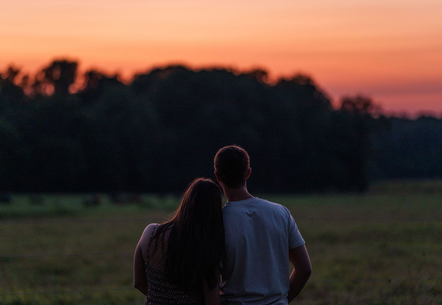 Greensboro, NC Couples Photographer, Ryan Harden, Reidsville NC, loving couple holds each other at sunset.