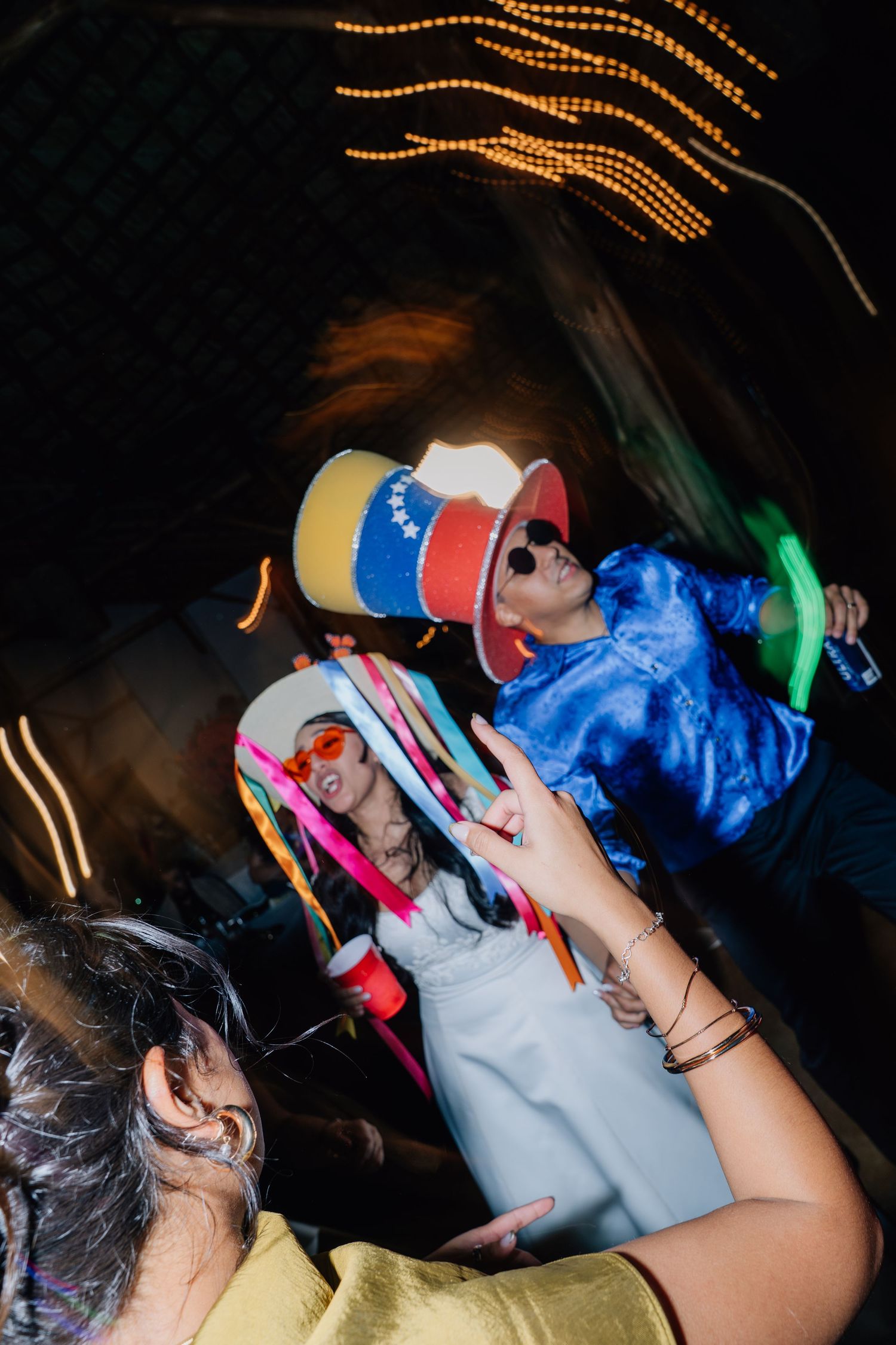 Lively dance party scene with colorful lighting and energetic party guests.
