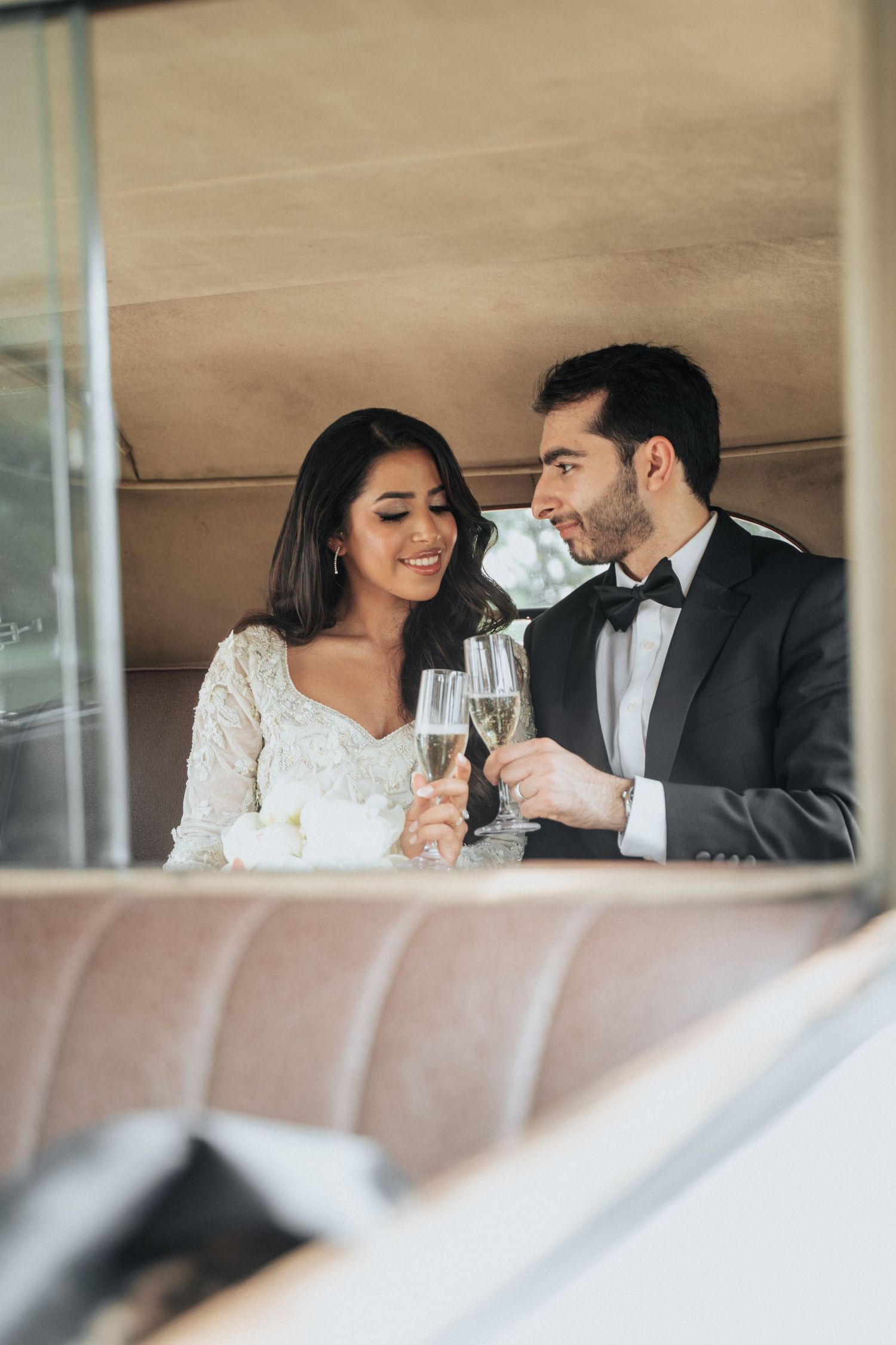 Intimate moment shared between newlyweds while toasting with champagne.
