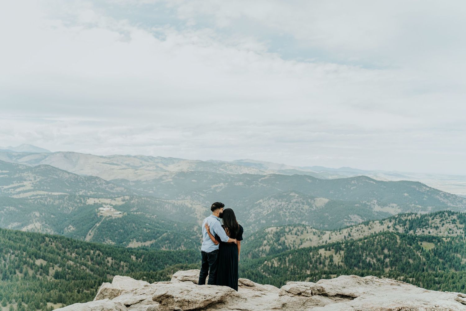 Scenic mountain landscape view with rolling hills stretching to the horizon.