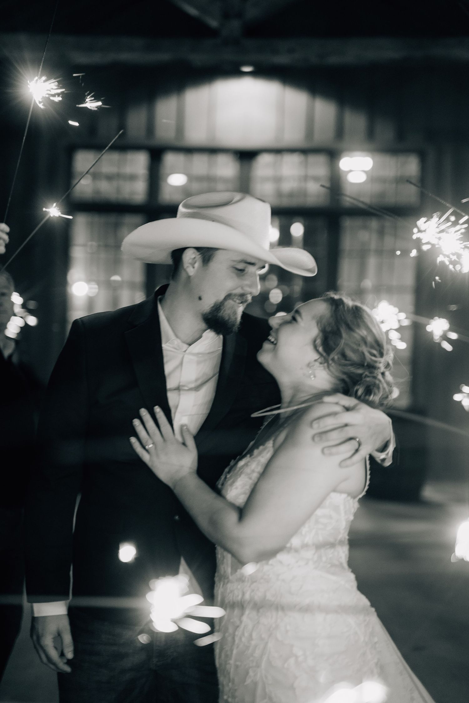 A romantic sparkler-lit moment during a wedding celebration.