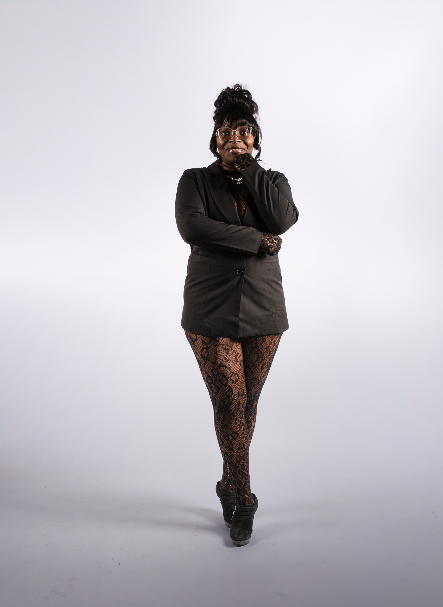 Figure in black clothing poses dramatically against white background in sequence.