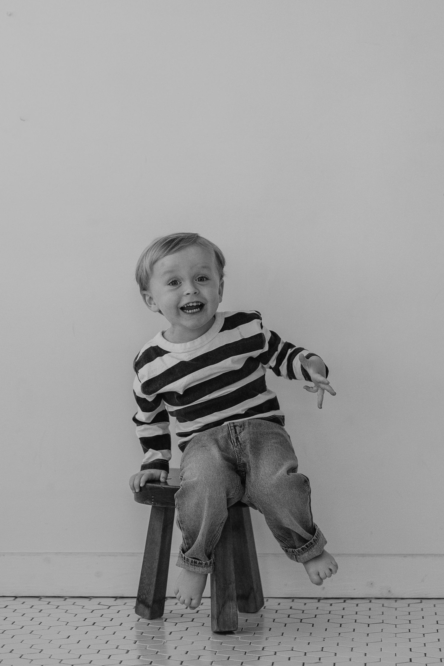 Progressive images of someone in a striped shirt sitting on a stool showing increasing happiness and laughter.