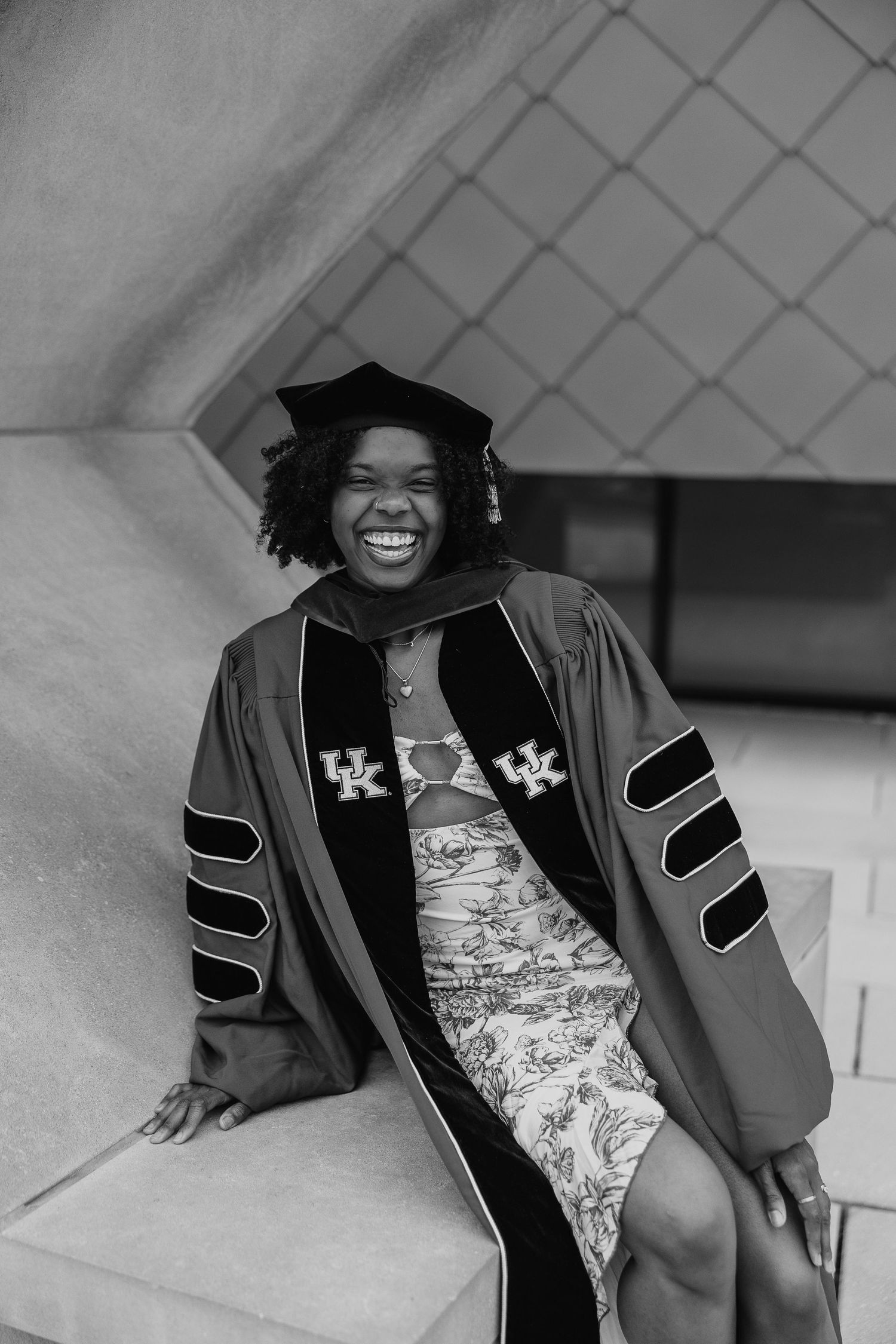 Black and white graduation photos showing joyful expressions and academic regalia.