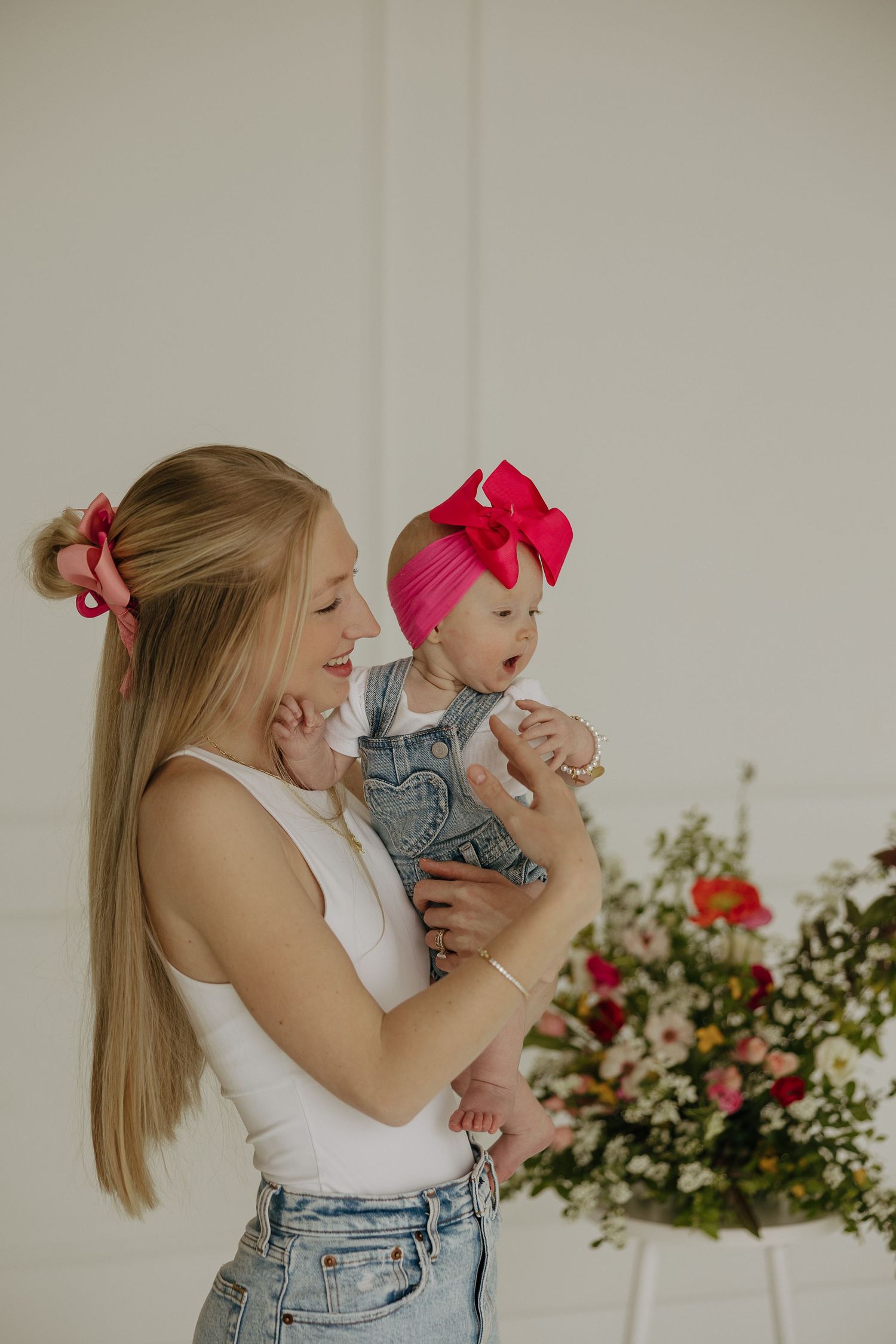 Joyful lifestyle photos featuring white tops and denim with floral accents.