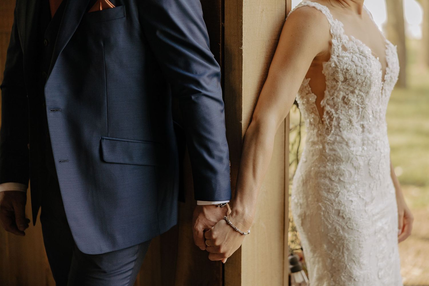 Intimate wedding day detail shots focusing on formal attire and lace.