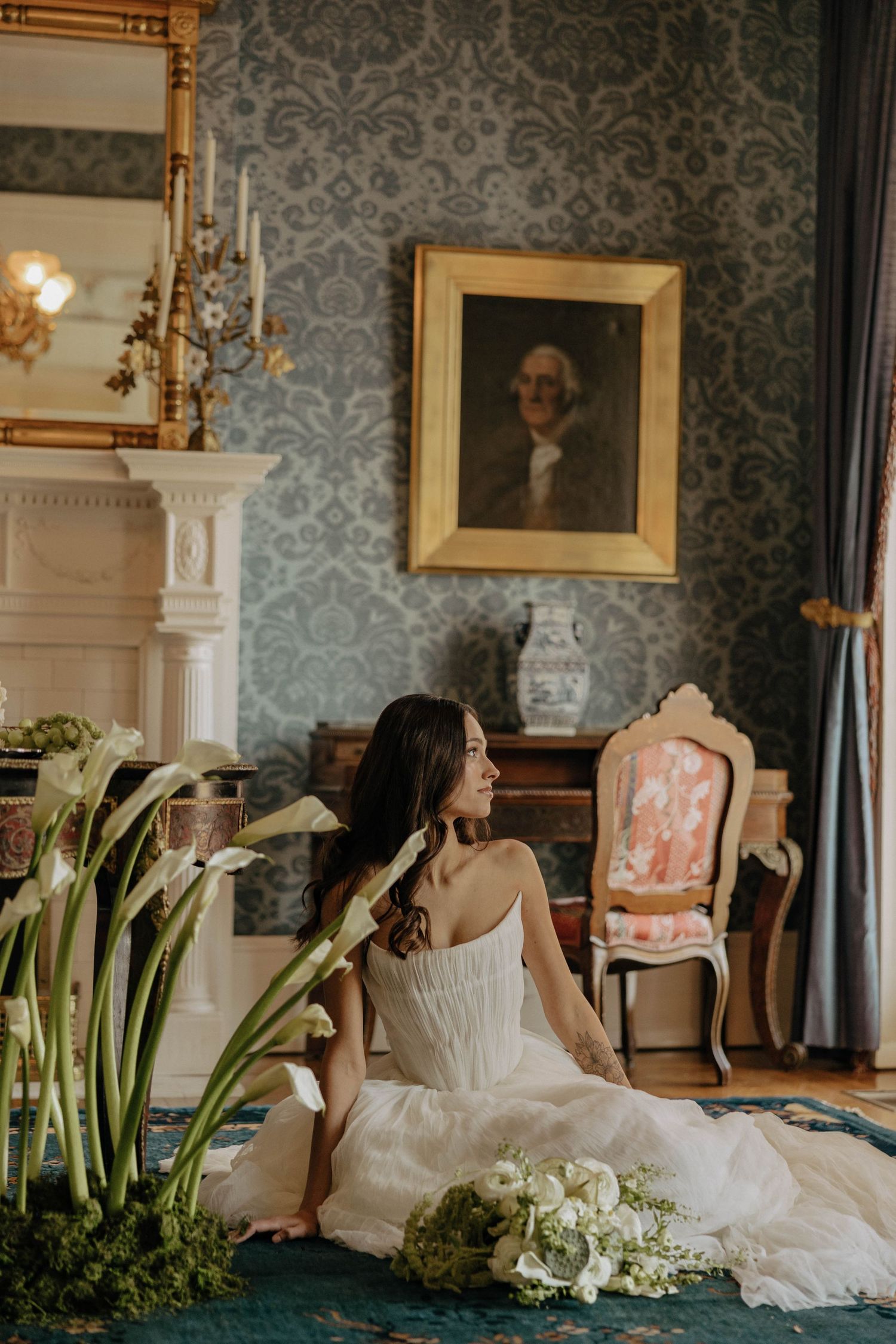 A bridal portrait session in an elegant room with calla lilies and vintage decor.