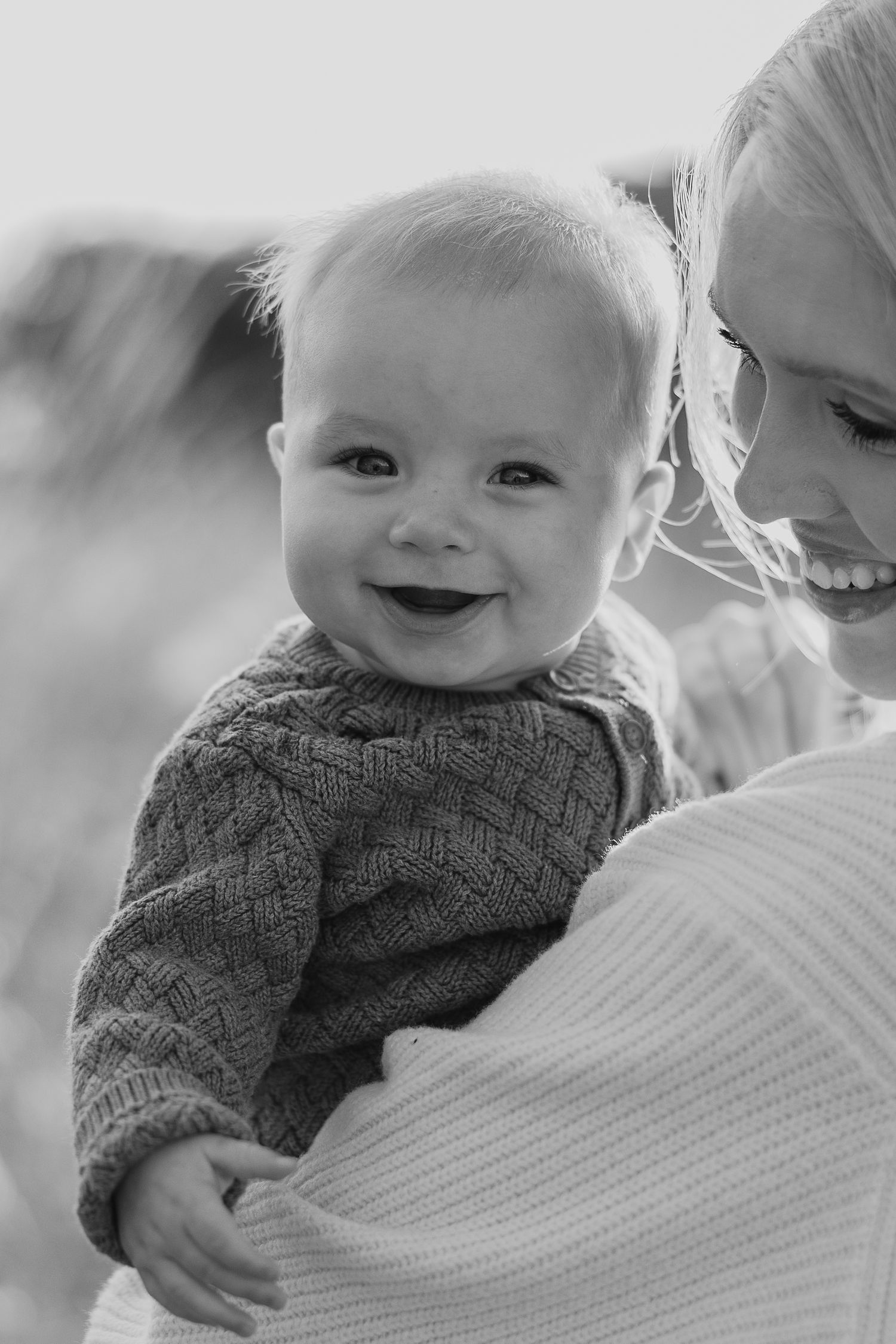 Black and white intimate portrait capturing tender family moments.