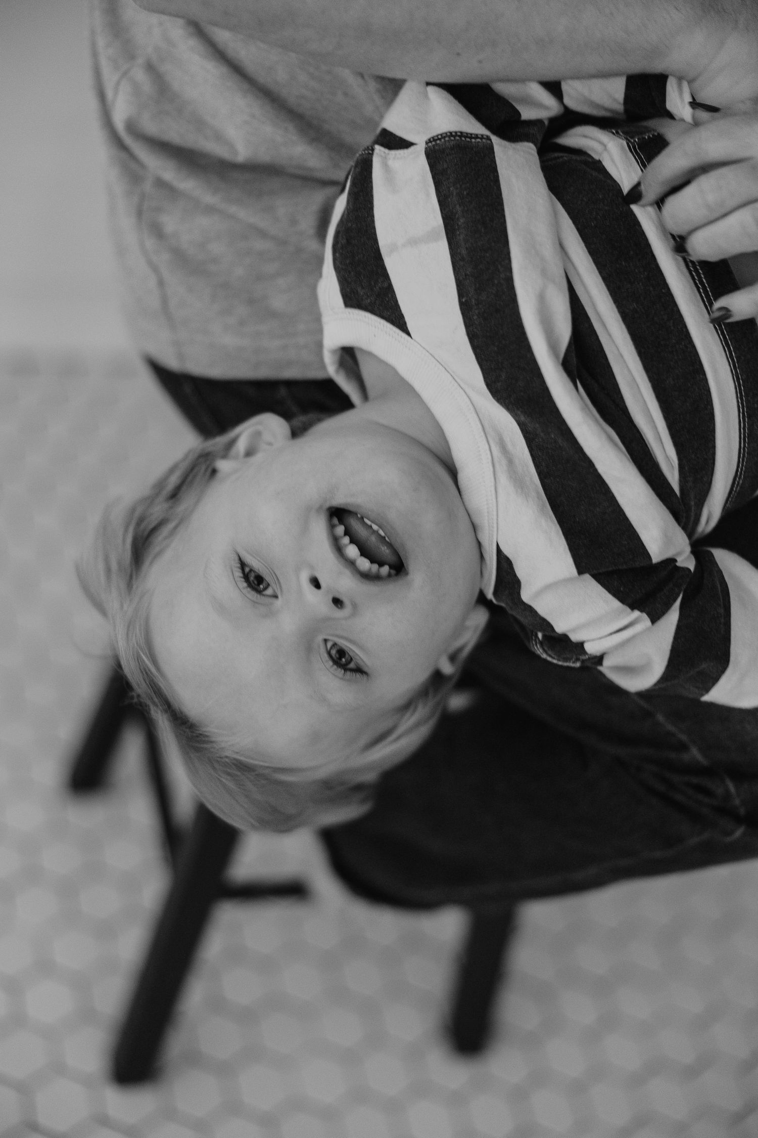 Black and white close-up portraits showing playful expressions in a series of connected shots.