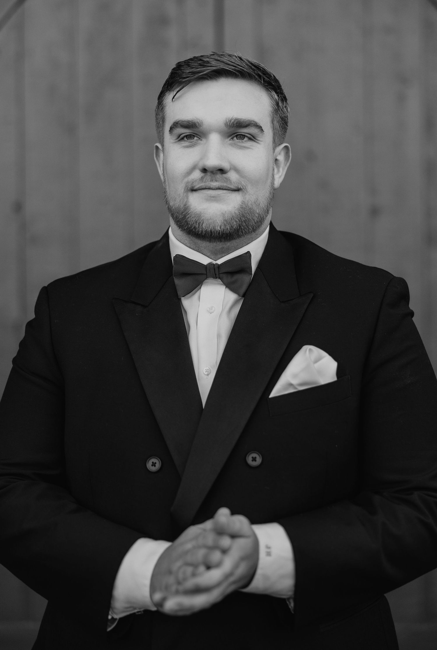 Black and white portrait series showing expressions in formal attire against dark background.