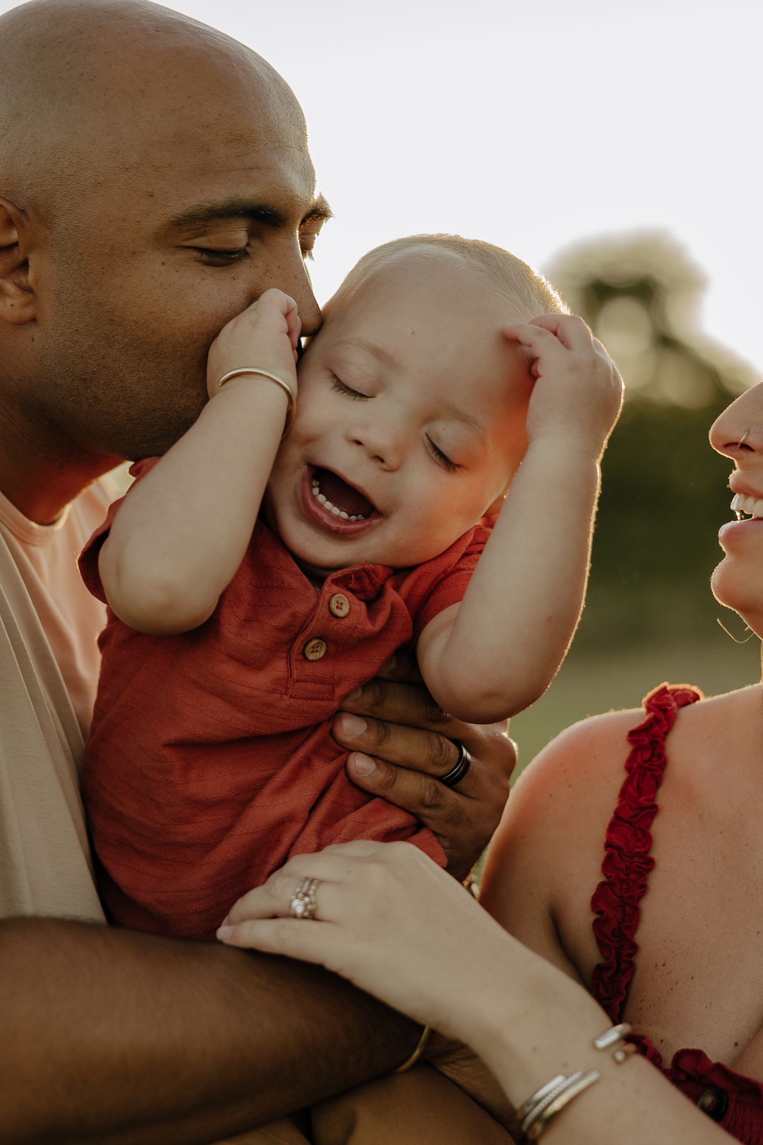 Intimate family portrait series captured in warm sunset lighting.