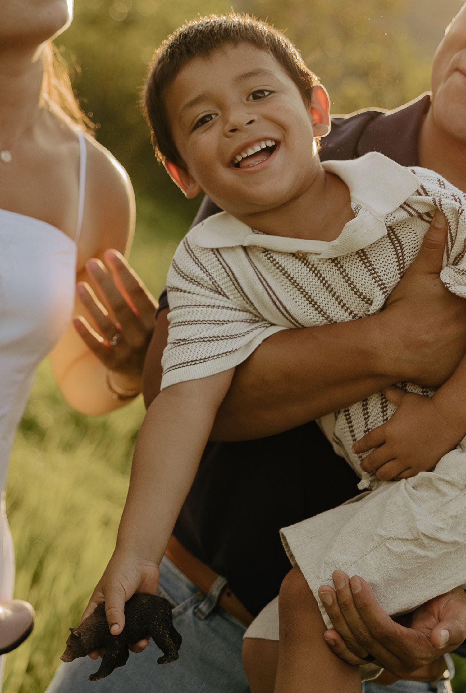 Joyful candid moments captured during an outdoor family photoshoot.