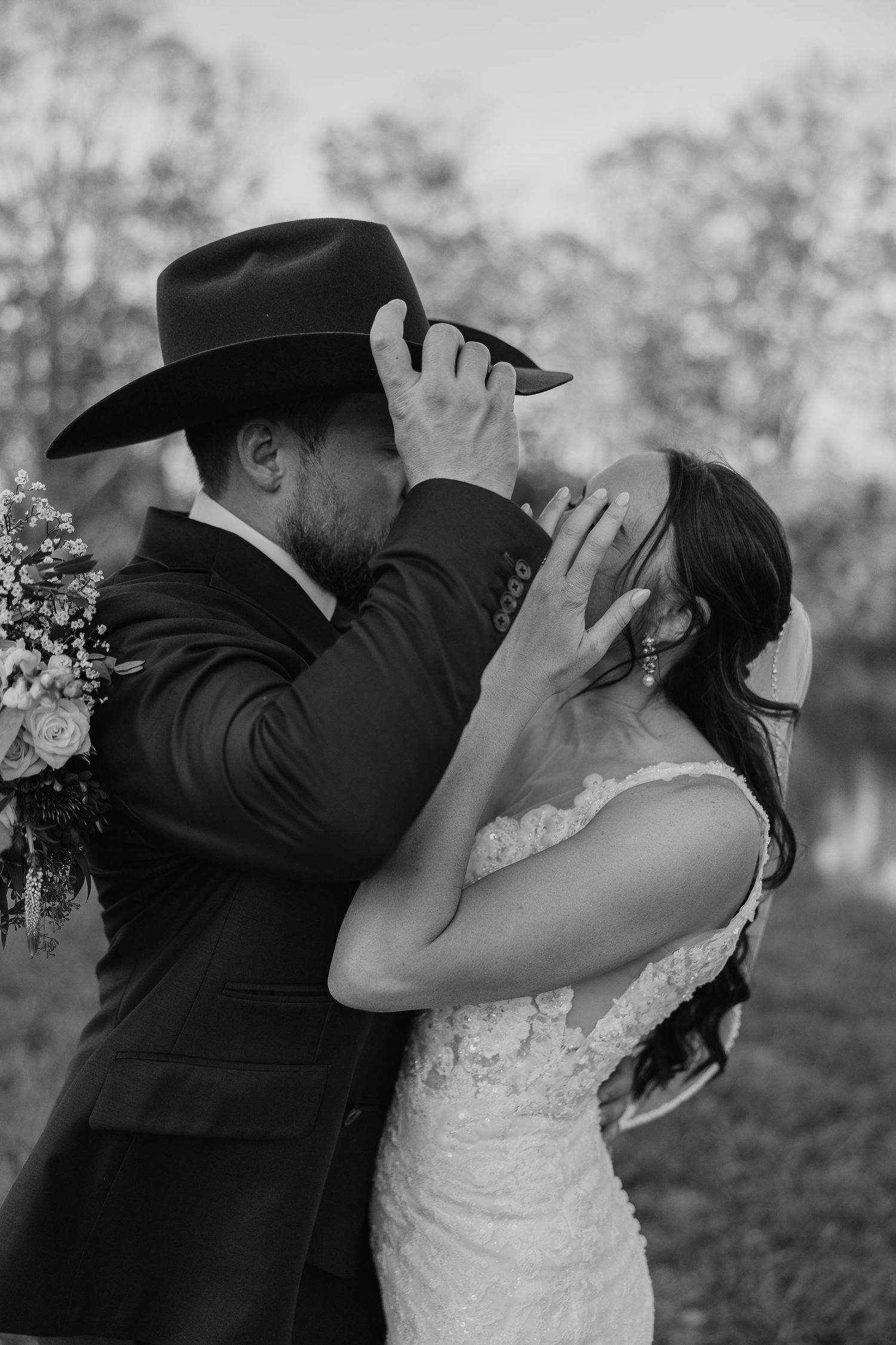 Black and white wedding photo series showing a couple in a romantic dip kiss pose outdoors.