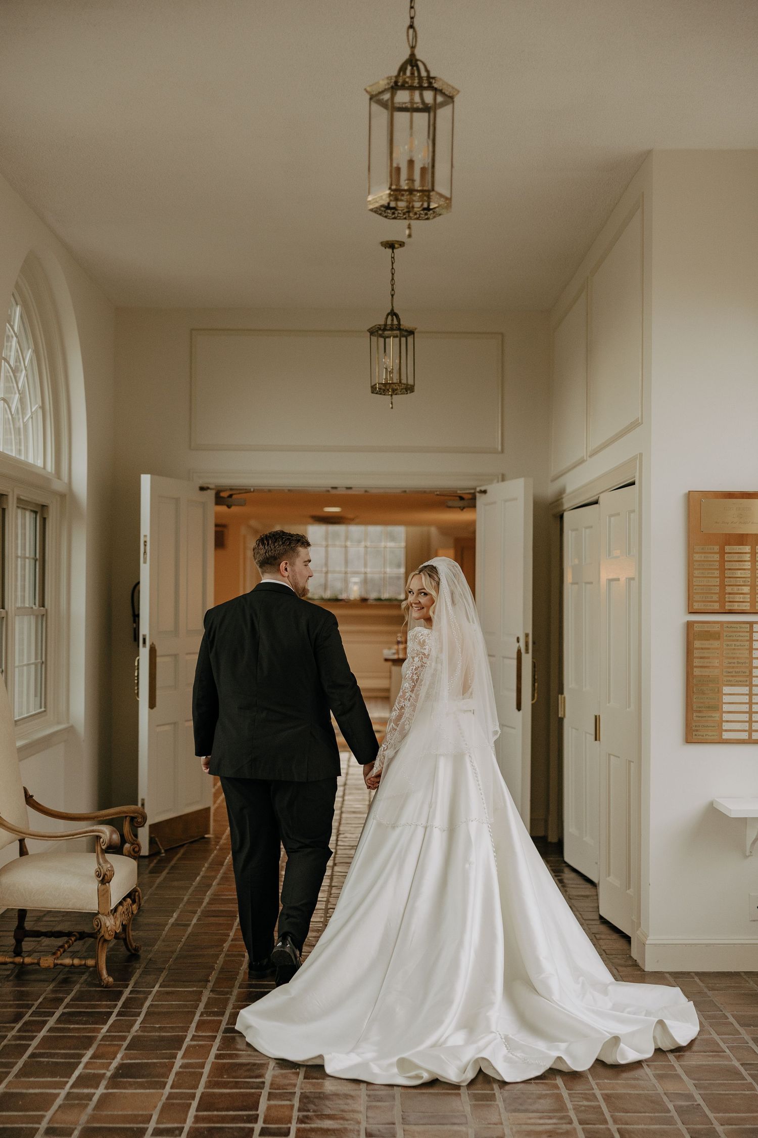 Sequence of wedding photos showing a bride in a flowing white gown and groom walking down an elegant hallway.