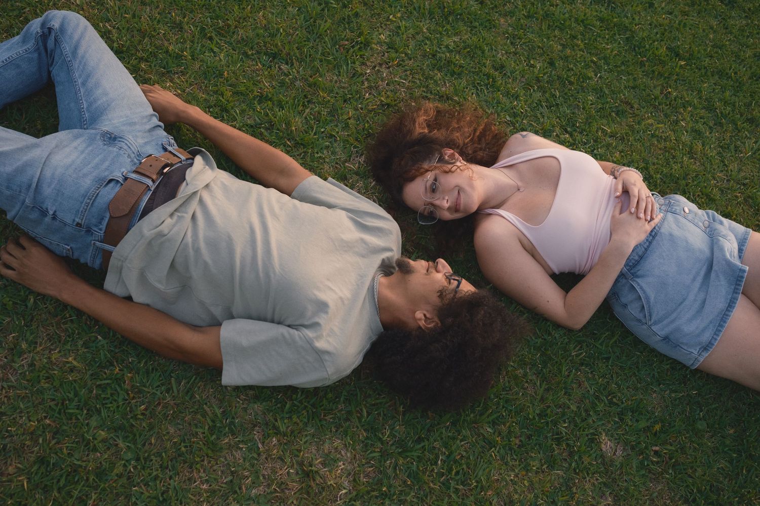 Charleston Couples Photo session of couple laying in park on grass field