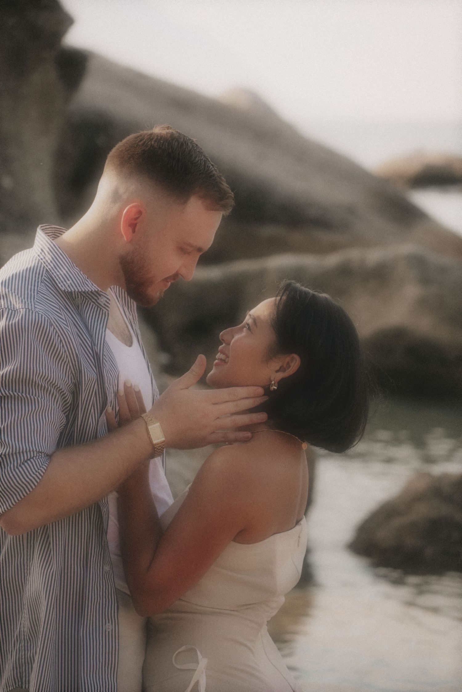 A couple dancing romantically on a beach in Cape Town.
