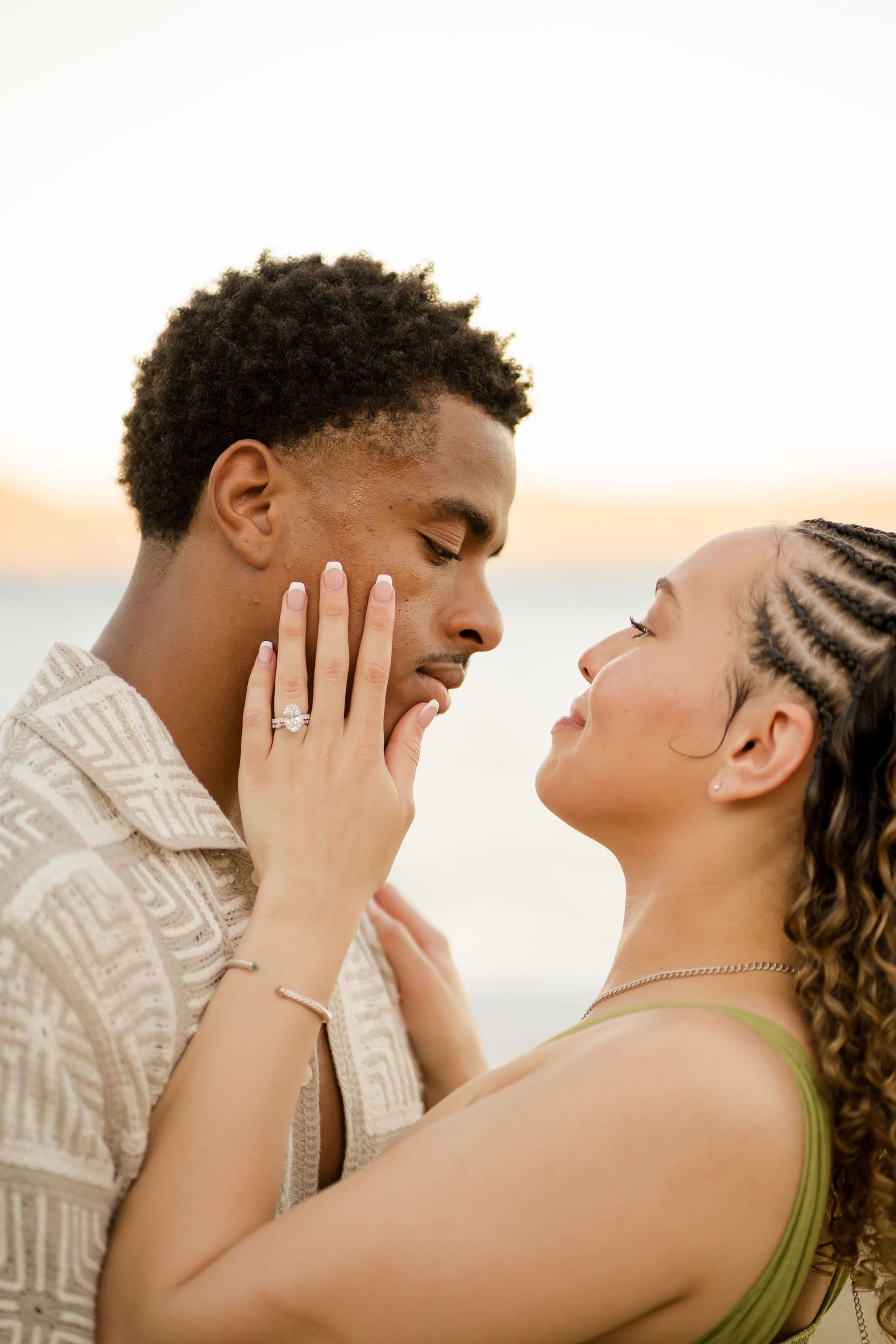 Engaged couple sharing a romantic moment during their photography session at Andaz Peninsula Papagayo, Costa Rica.
