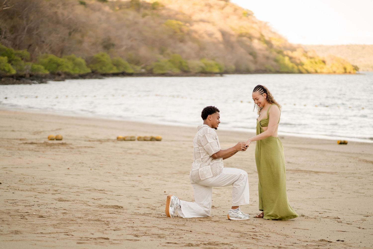 Beach proposal photographed at Andaz Peninsula Papagayo in Costa Rica during golden hour.