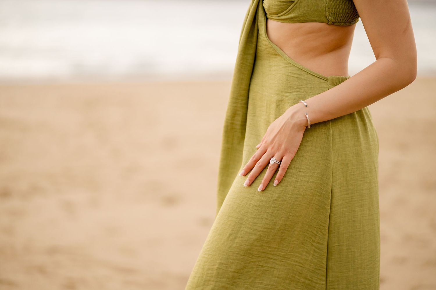Close-up of a newly engaged woman showing her engagement ring during a beach session in Peninsula Papagayo, Costa Rica.