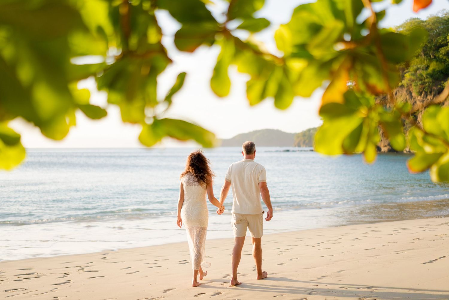 Mother and son walking together along the beach during a family photography session in Peninsula Papagayo, Costa Rica.