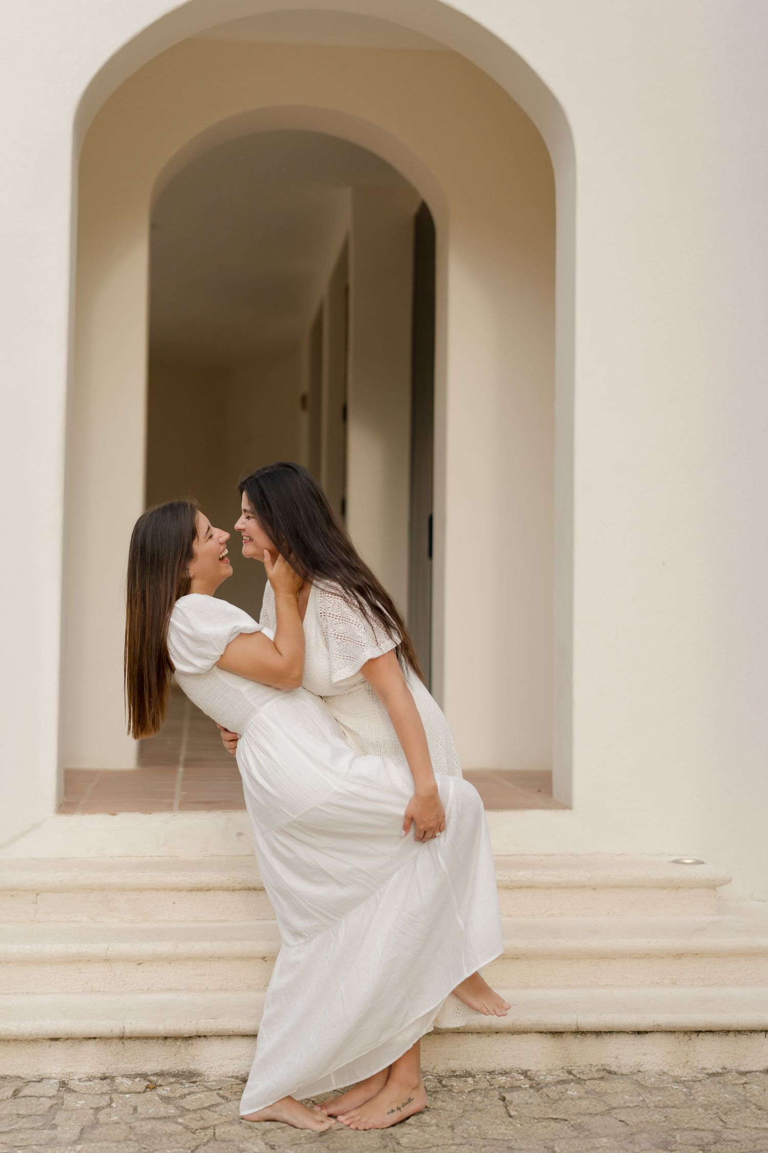 Couple embracing beneath the arches of Las Catalinas during a romantic photography session in Guanacaste, Costa Rica.