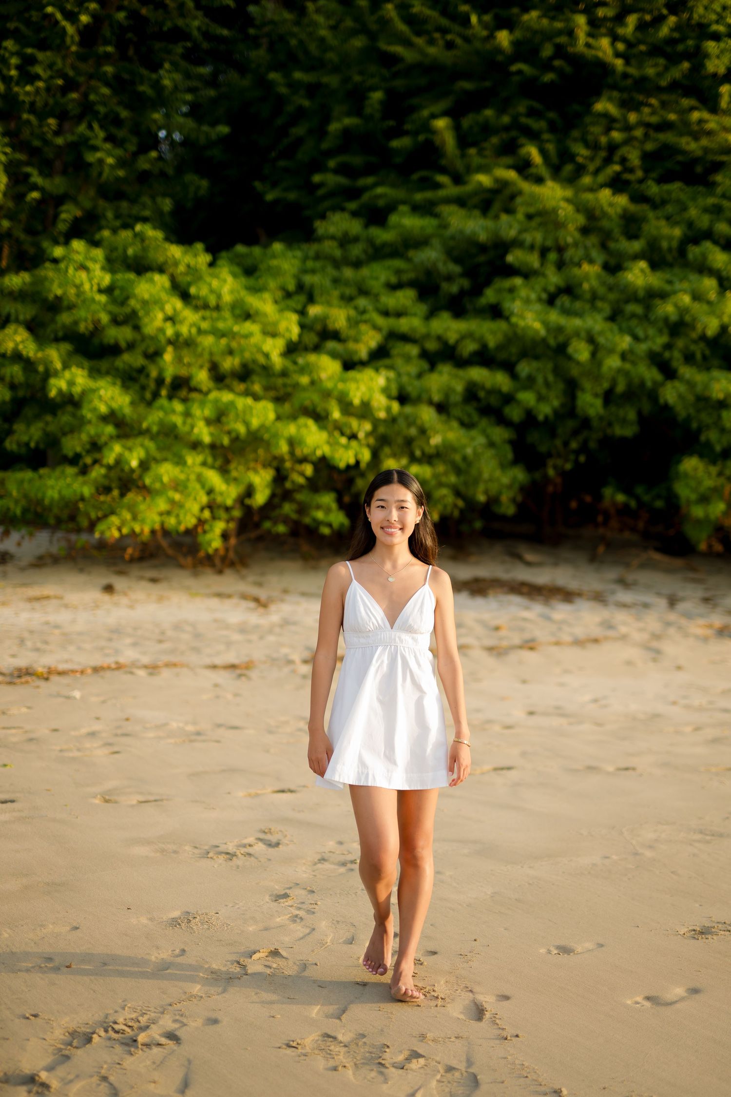 Young woman photographed on a tropical beach during a family photography session at Four Seasons Peninsula Papagayo, Costa Rica.