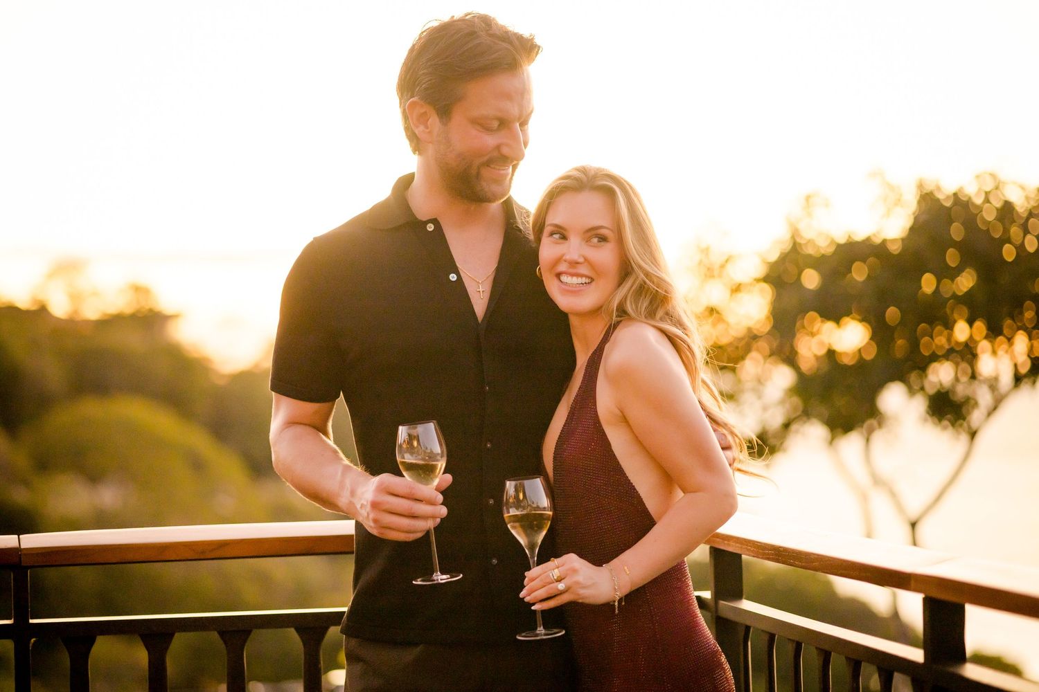 Couple celebrating their engagement with champagne at sunset at Nekajui in Peninsula Papagayo, Costa Rica.