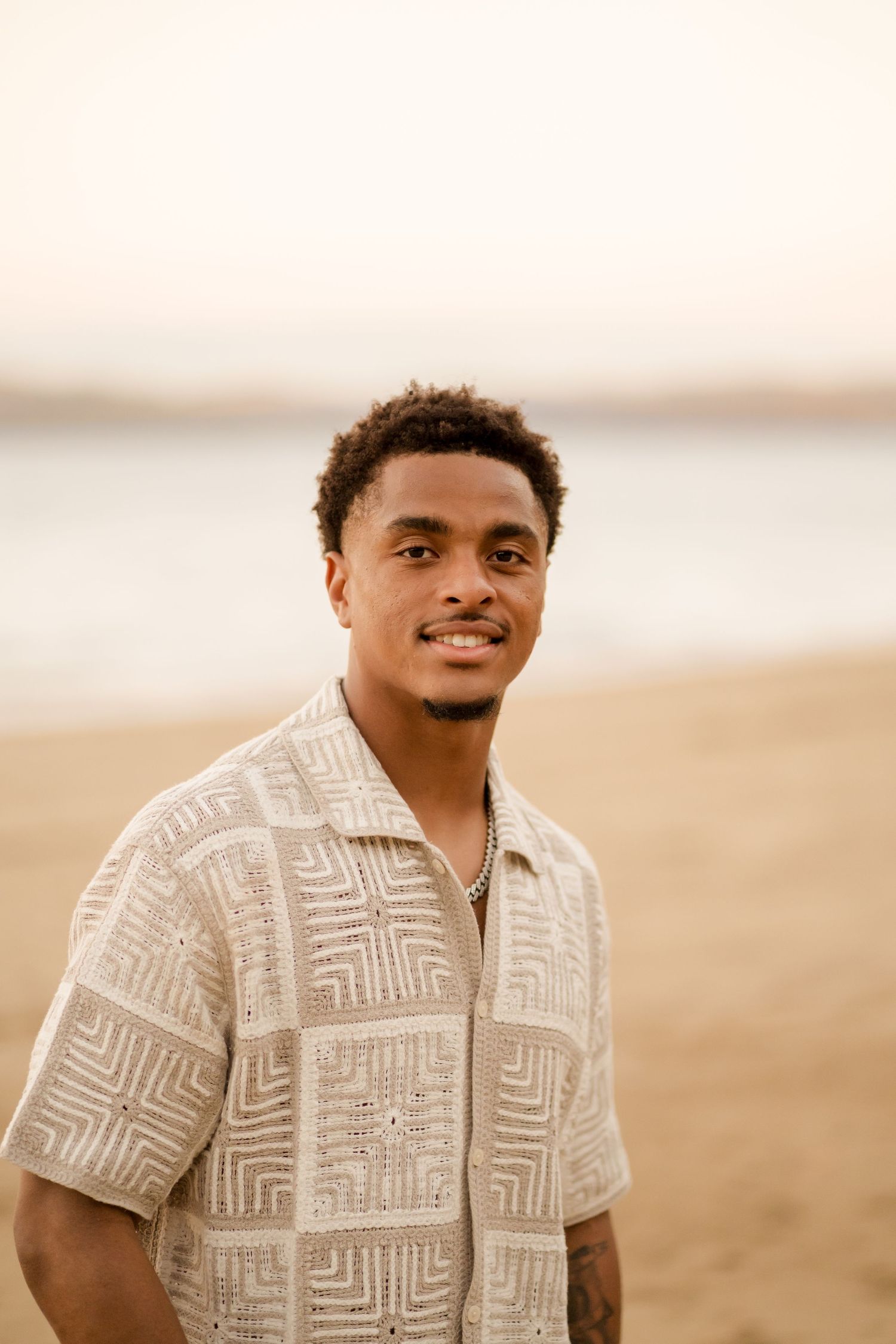 Portrait of the groom-to-be on the beach during an engagement photography session at Andaz Costa Rica.