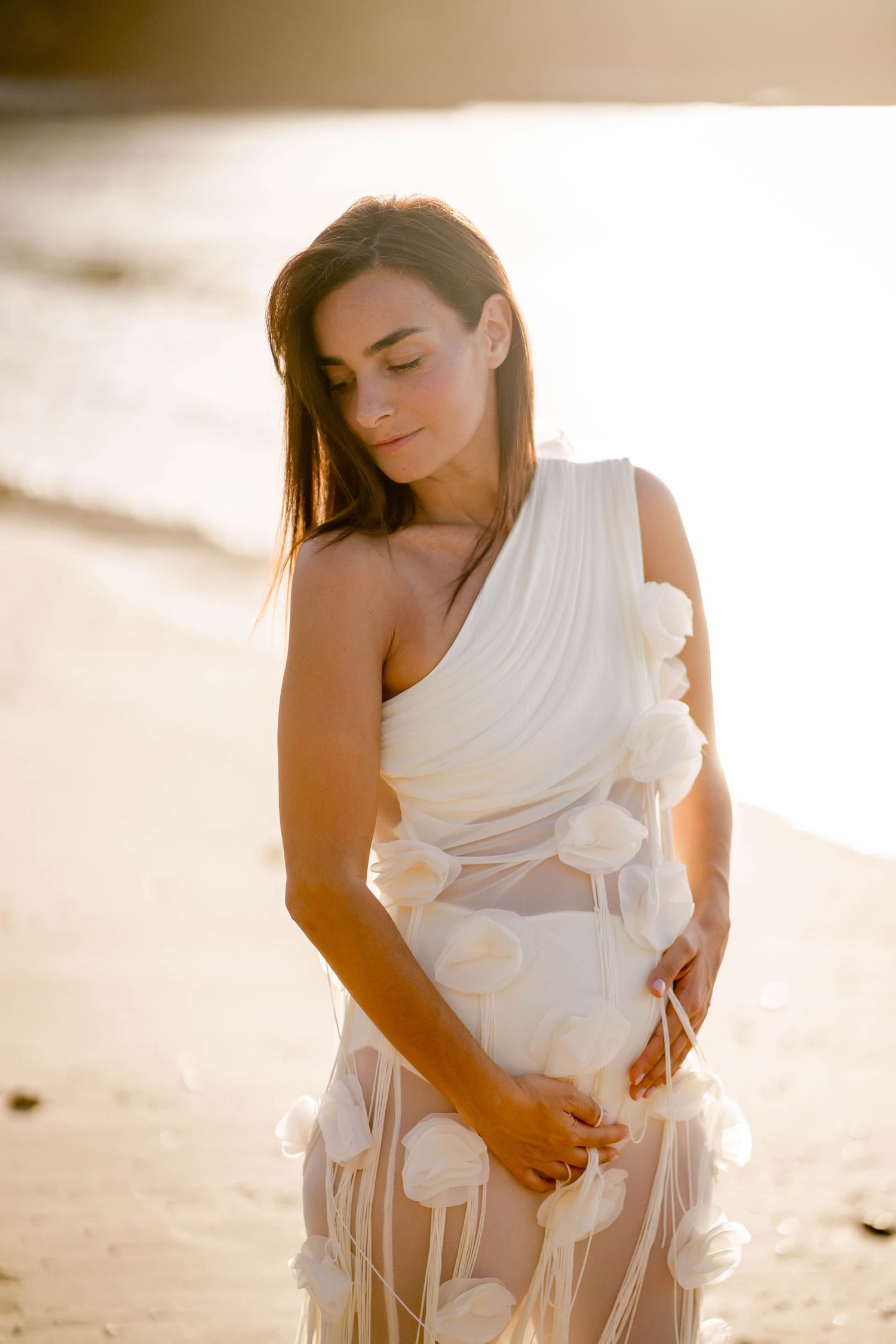 Expecting mother during a sunset babymoon photography session at Four Seasons Resort Costa Rica at Peninsula Papagayo.
