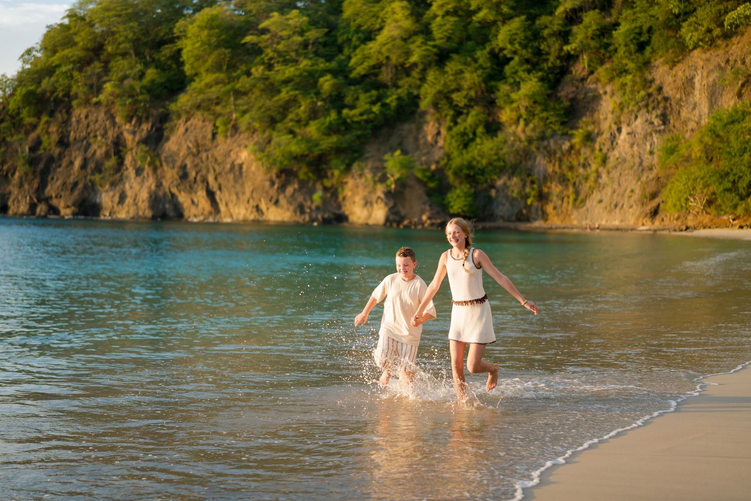 Mother and child playing in the ocean during a family photography session at Four Seasons Costa Rica at Peninsula Papagayo.