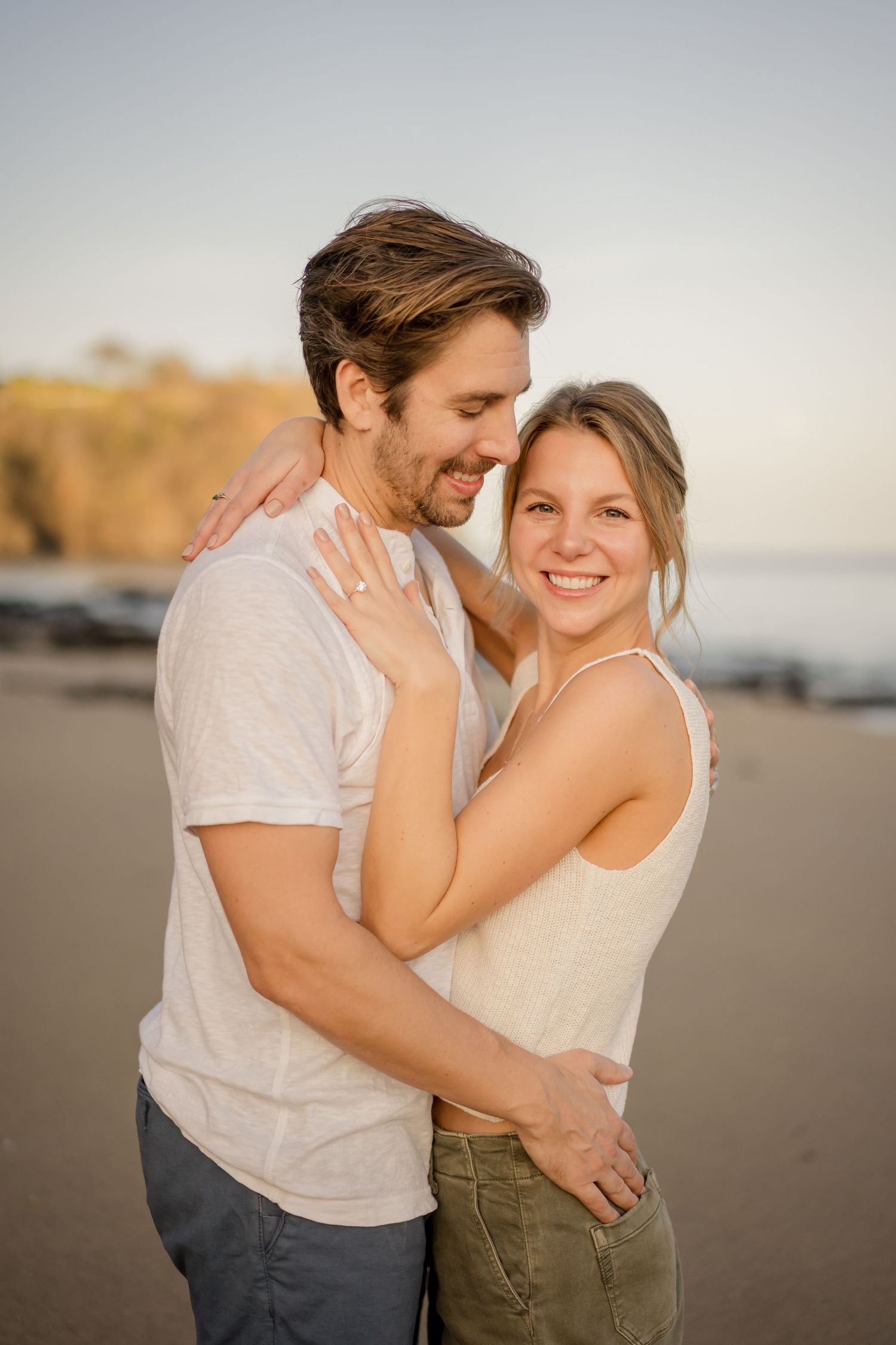 Couple embracing during a romantic beach photography session at Playa Hermosa in Guanacaste, Costa Rica.