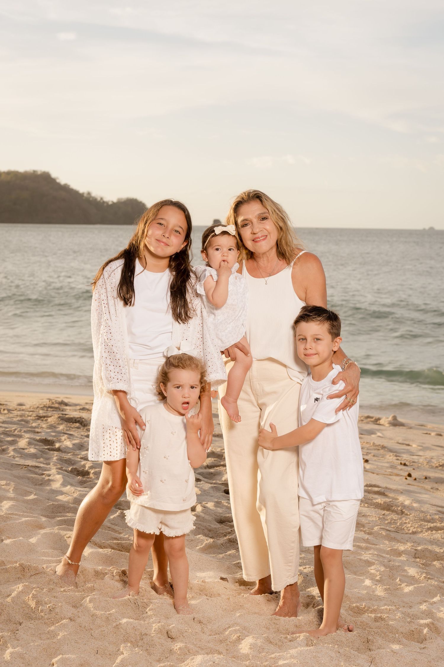 Grandmother with grandchildren at Playa Conchal, costa Rica