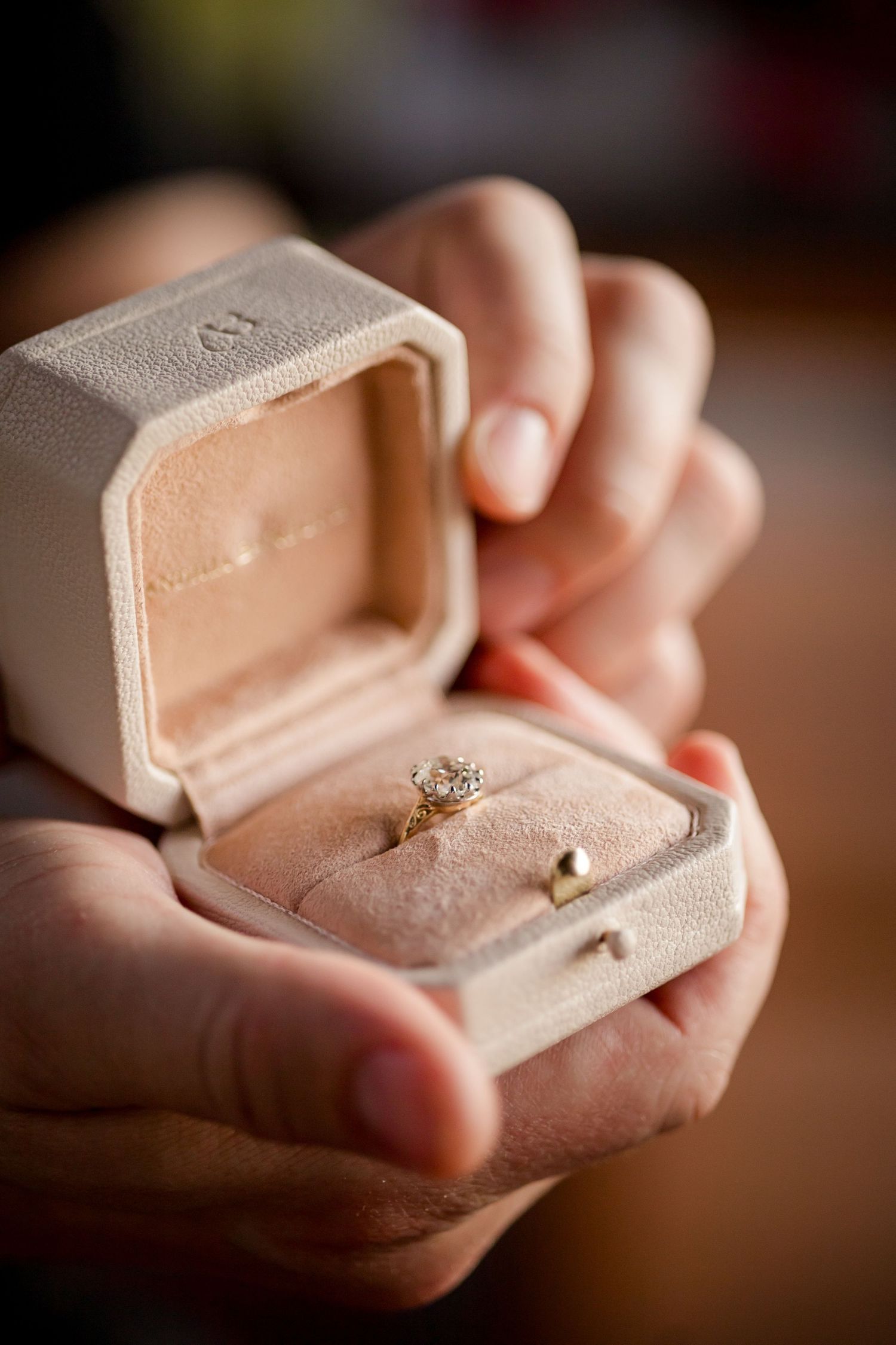 Close-up of an engagement ring during a romantic proposal celebration at Nekajui, a Ritz-Carlton Reserve.