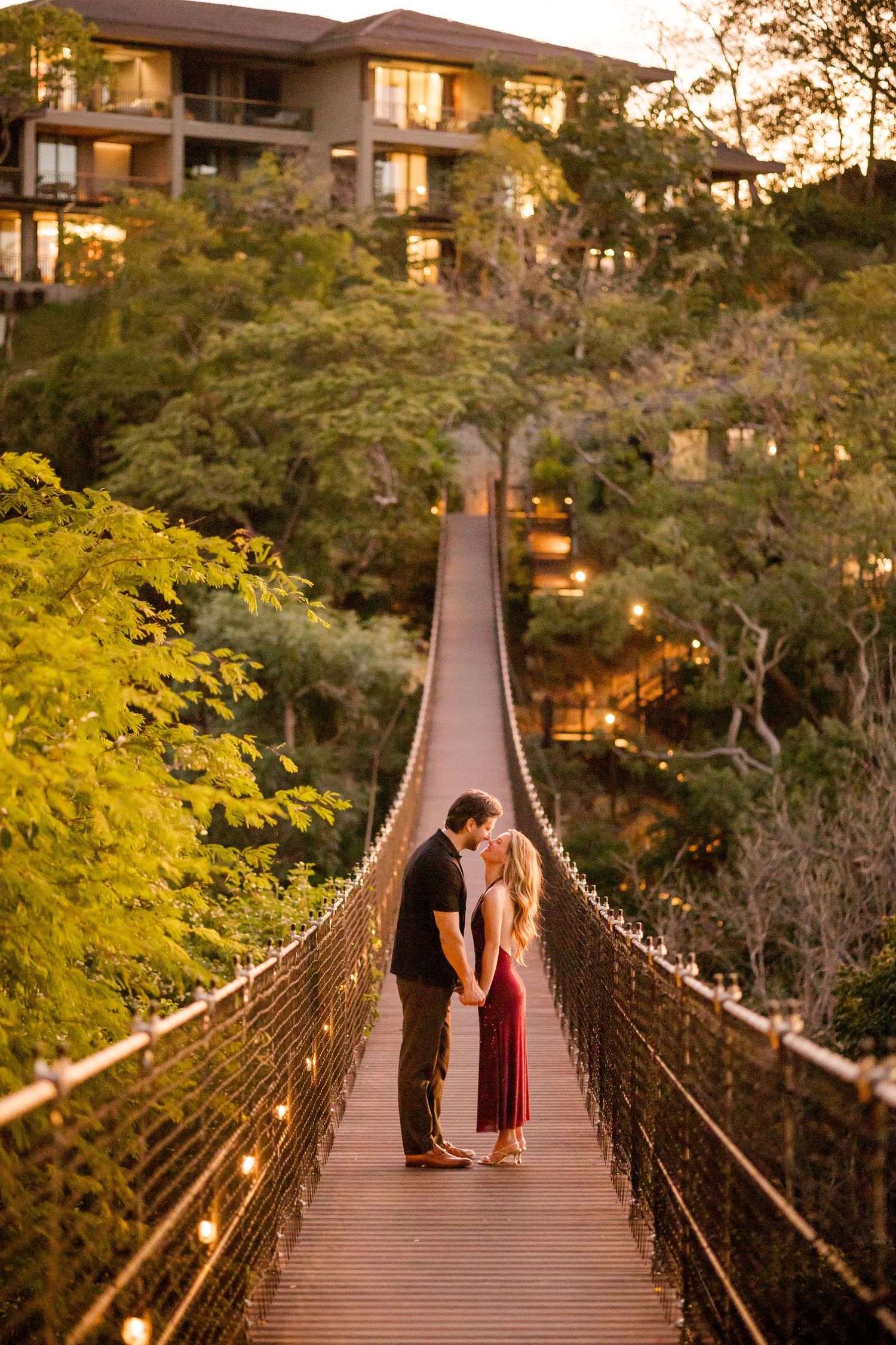 Engaged couple photographed together on a suspension bridge at Nekajui in Peninsula Papagayo, Costa Rica.