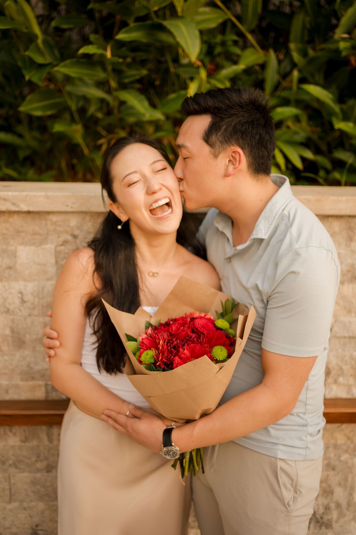 Couple laughing together during a relaxed photography session in Costa Rica.