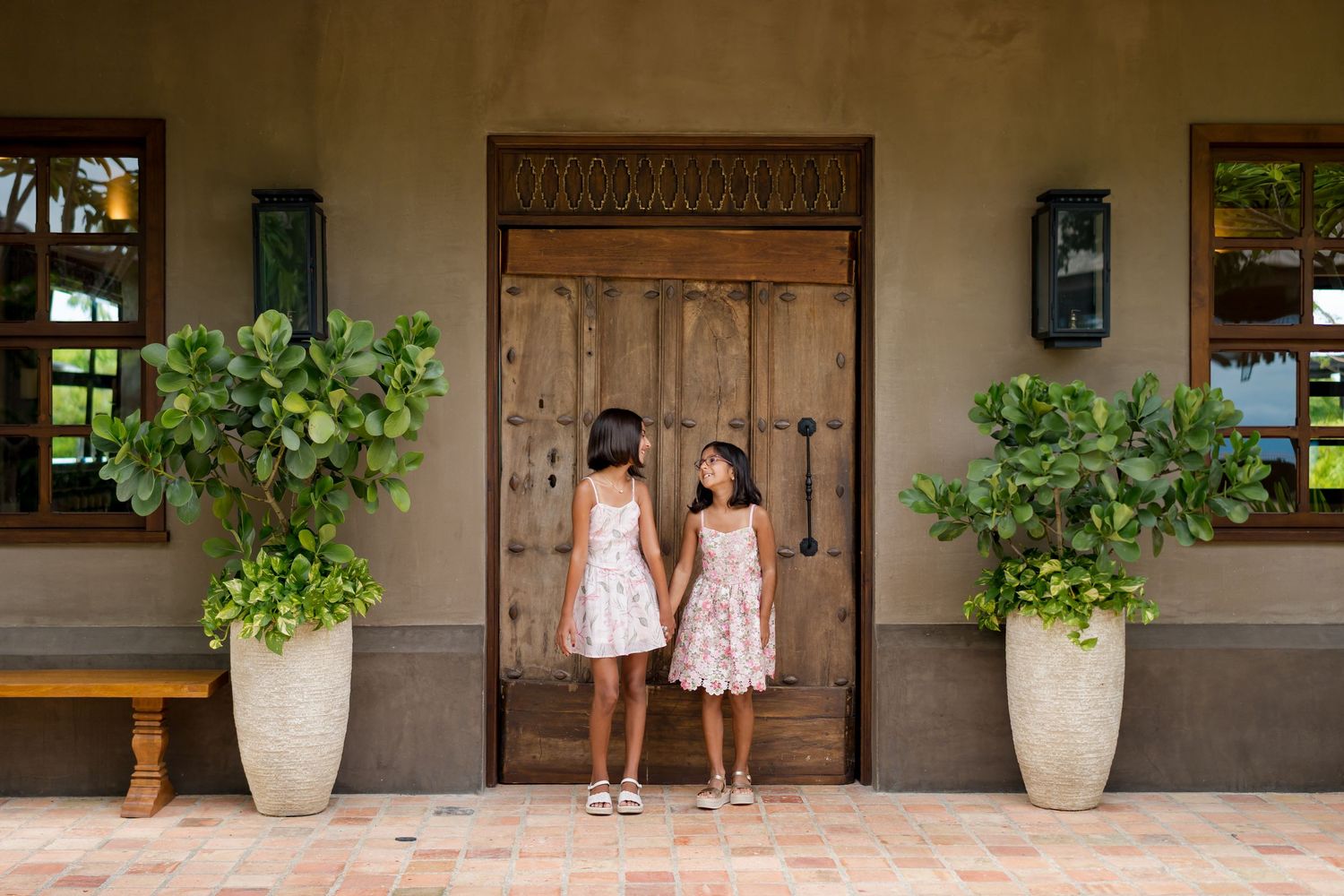 Two sisters photographed outside Nekajui, a Ritz-Carlton Reserve in Peninsula Papagayo, during a Costa Rica family session.