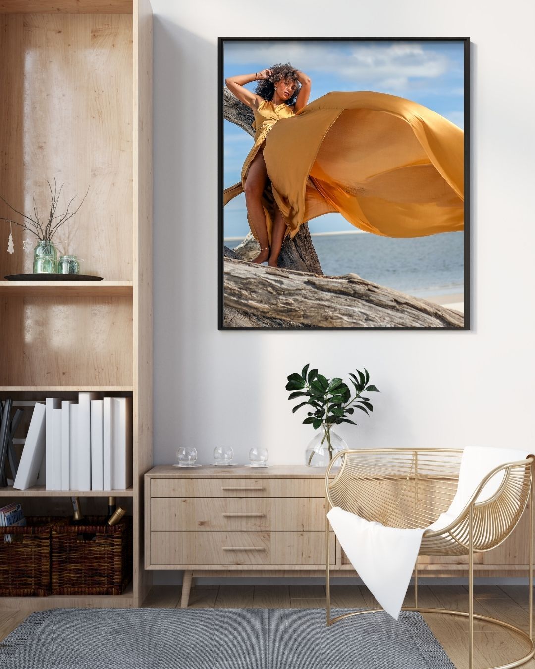 Framed portrait of a woman in a flowing gold flying dress on the rocks — Jacksonville flying dress photography session.