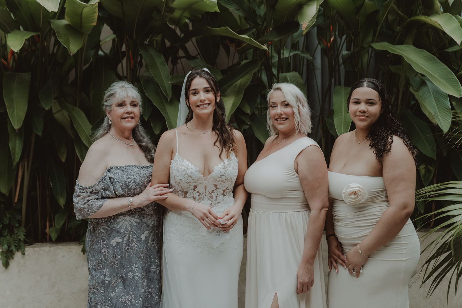 Bride and her bridesmaids together on the wedding day.