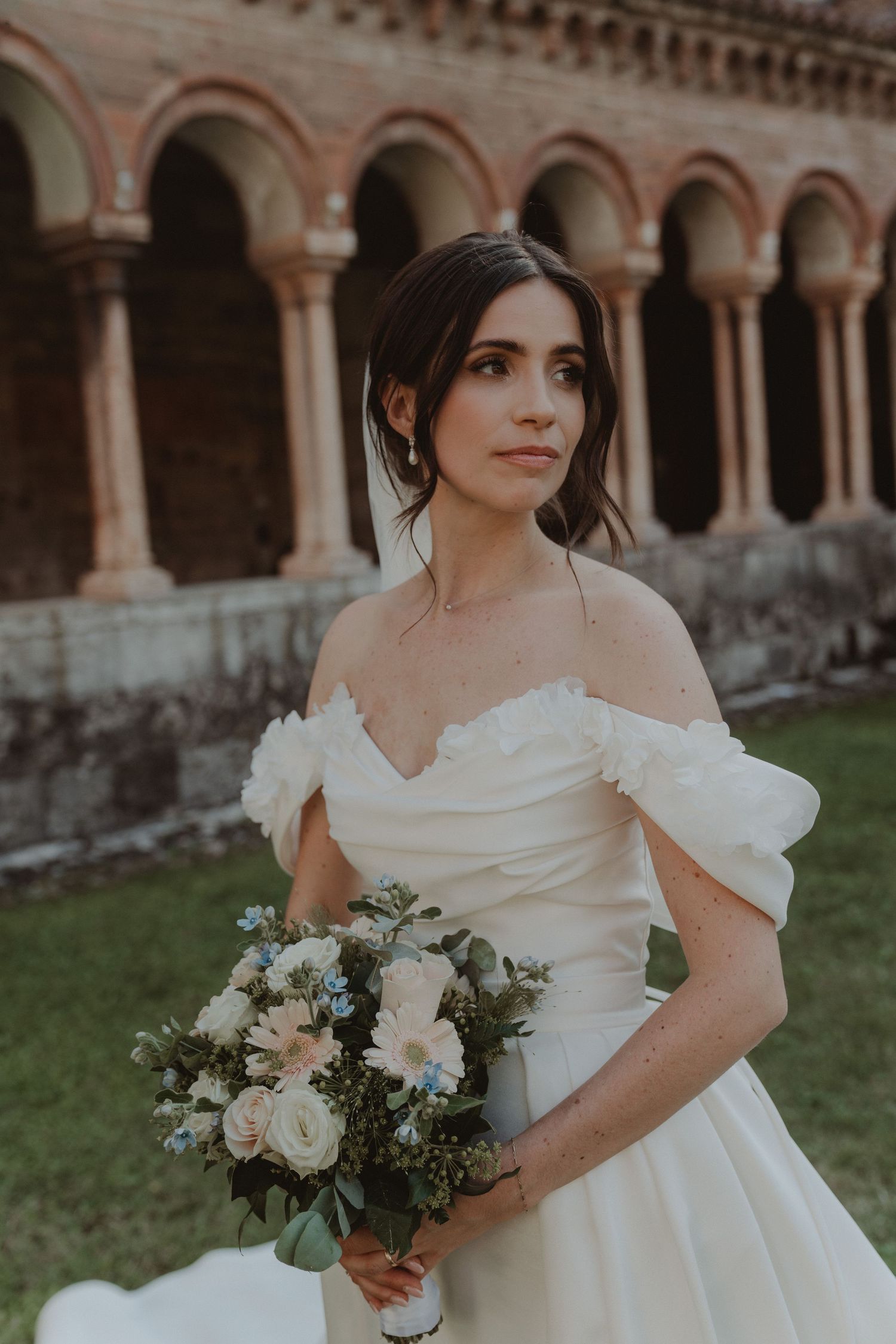 Portrait of a bride holding her wedding bouquet.