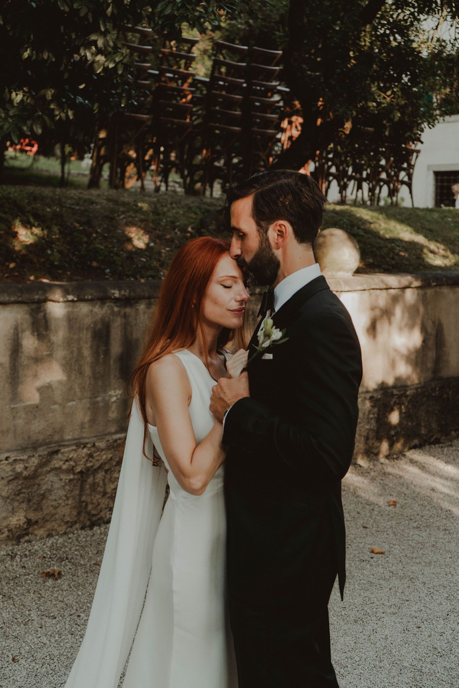 Wedding couple standing together at a historic villa in Verona, Italy.