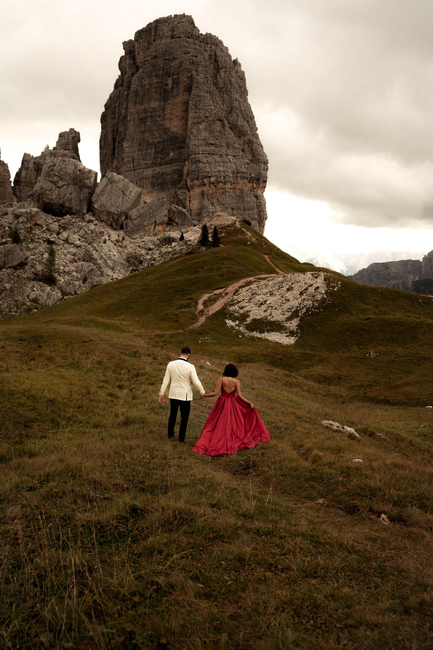 Newlywed couple with the iconic Tre Cime di Lavaredo in the Dolomites in the background.