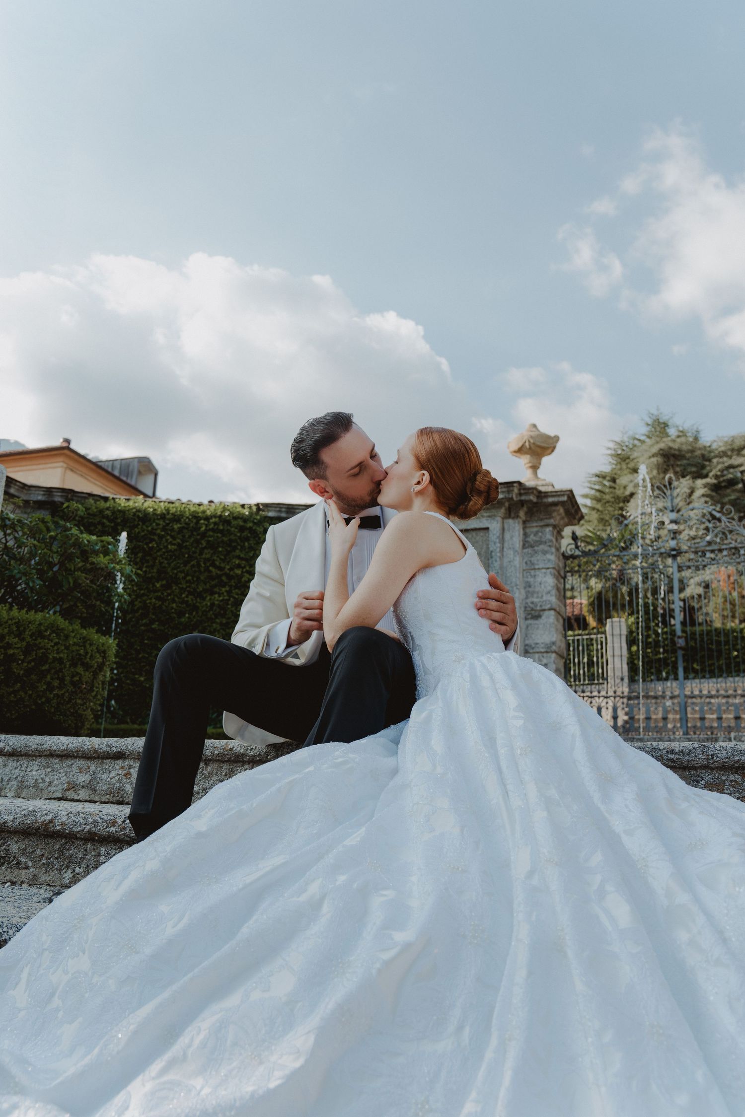 Timeless portrait of an elegant couple overlooking Lake Como