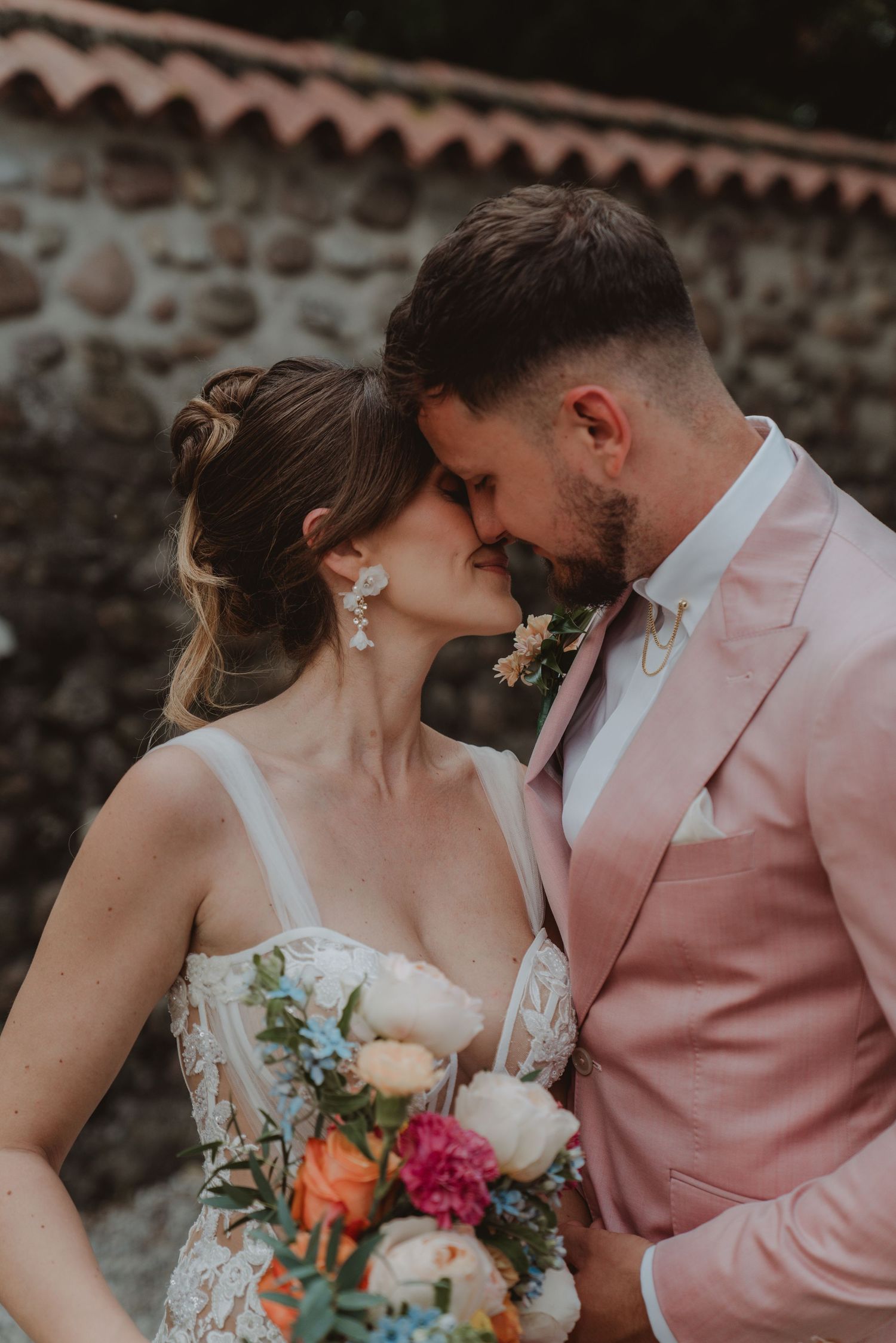 International newlywed couple sharing an intimate moment just before their first kiss.