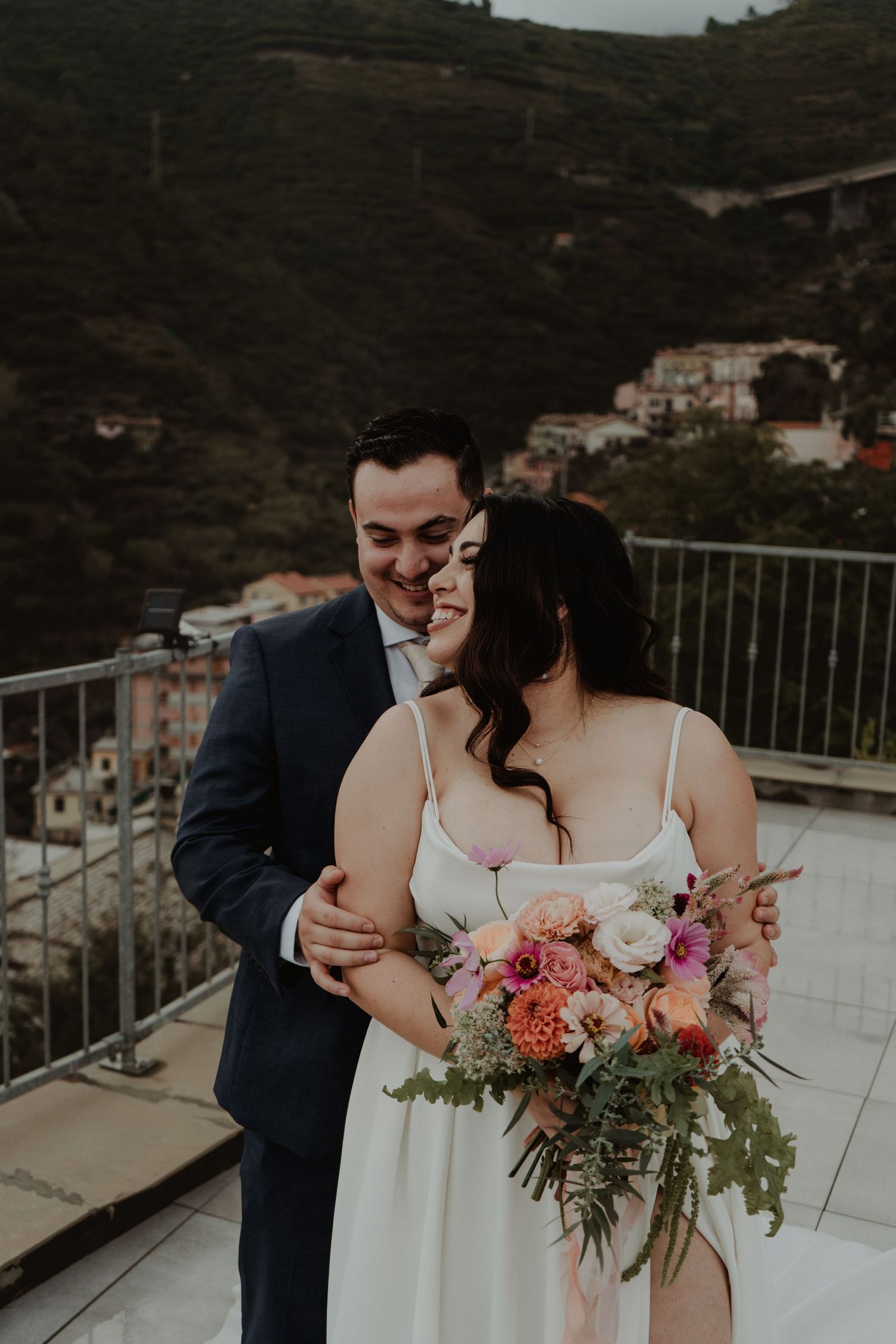 Newlywed couple in the picturesque Cinque Terre, Italy.