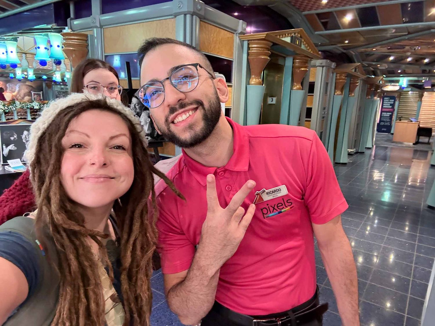 Four selfie photos in a row show people smiling together in what appears to be an indoor shopping or business space.