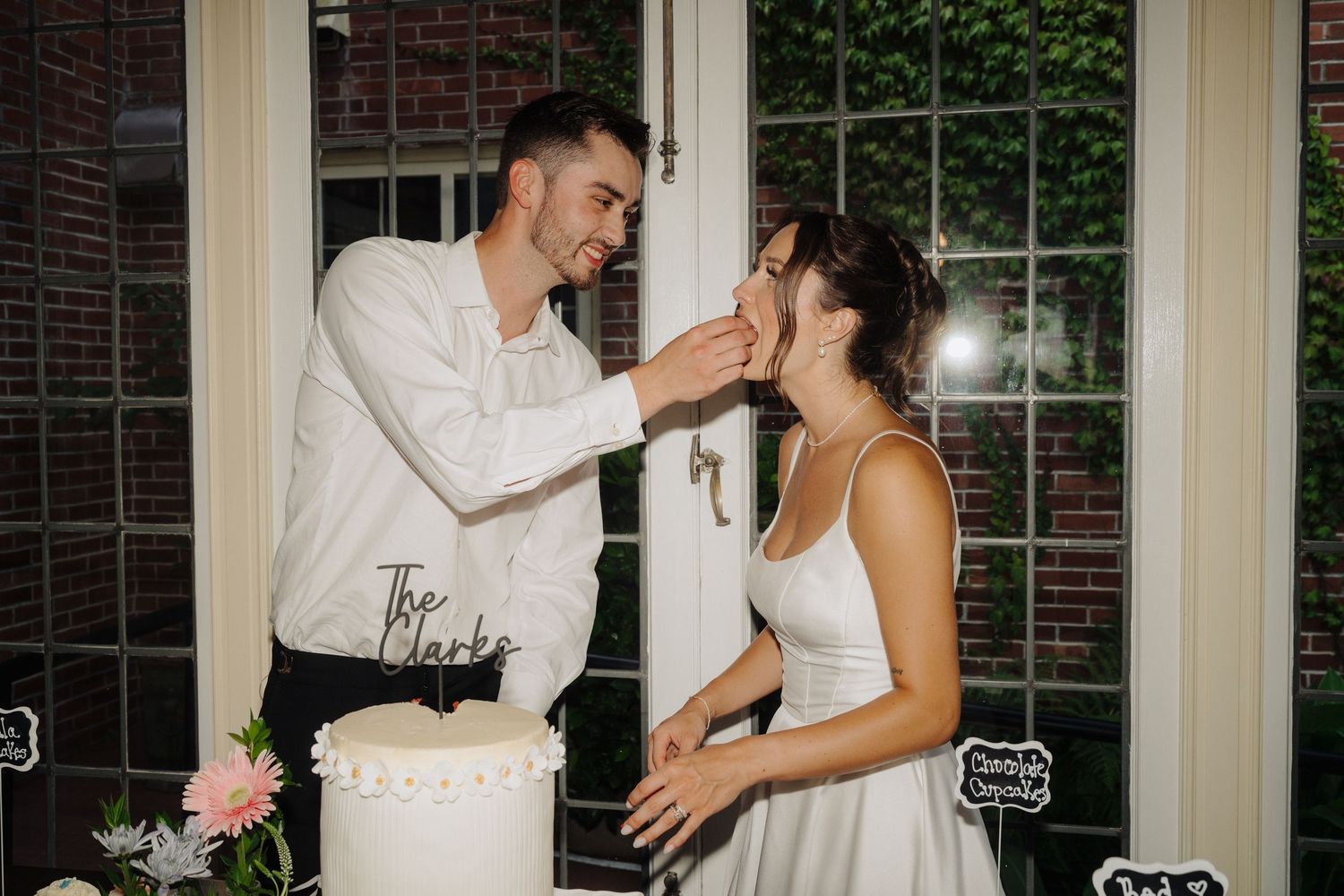 Romantic moments between newlyweds during their indoor reception.