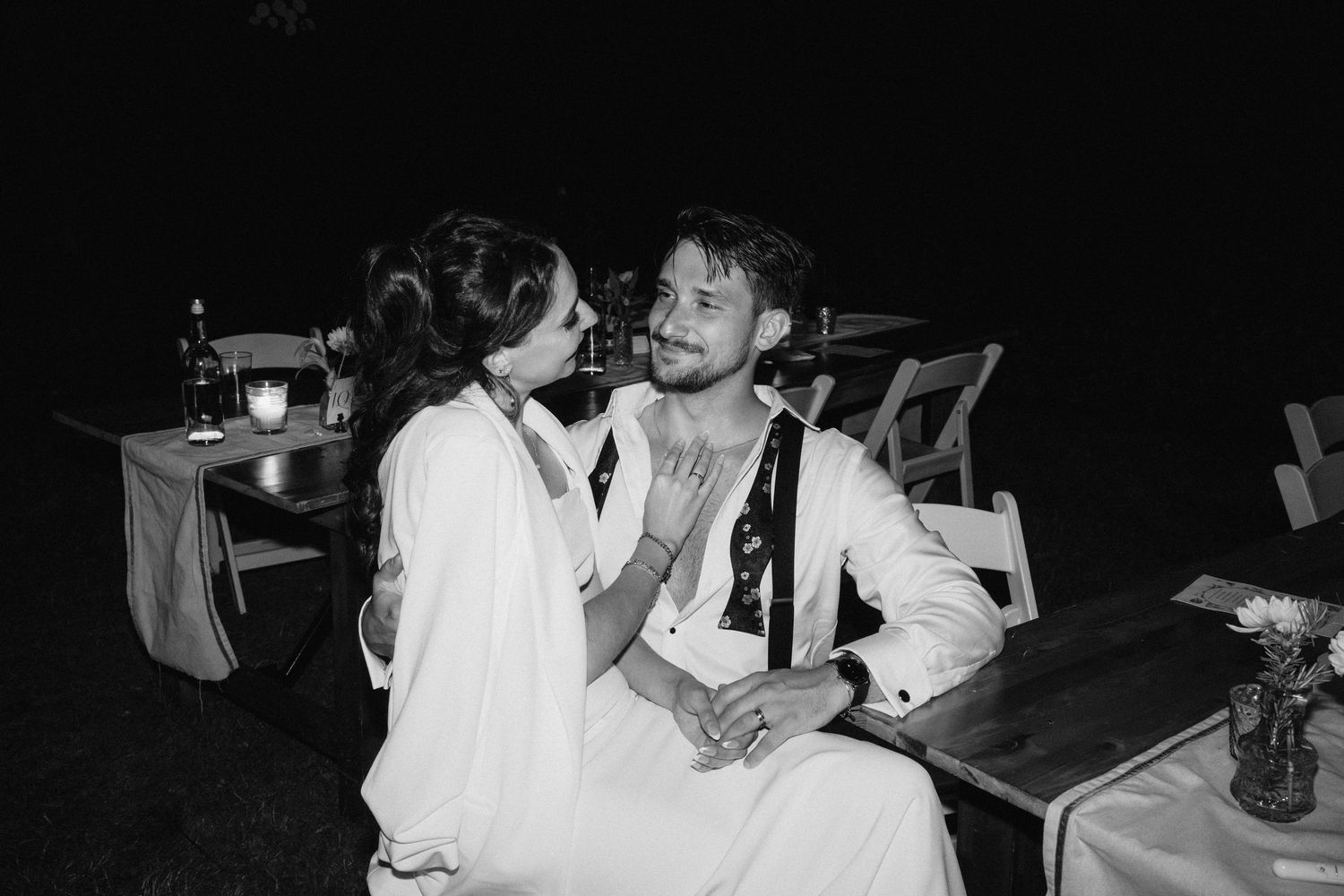 Black and white candid shots of wedding reception guests enjoying the celebration.