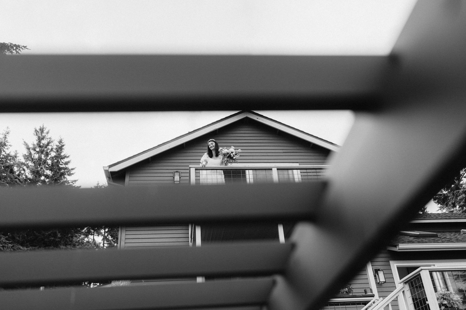 Architectural details of a residential roofline shown in dramatic black and white.