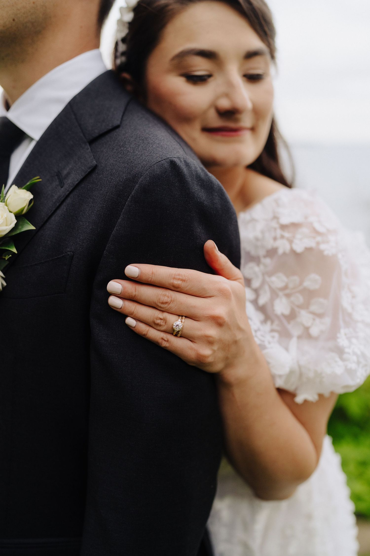 A close-up series of wedding photos showing tender embraces and a sparkling engagement ring.