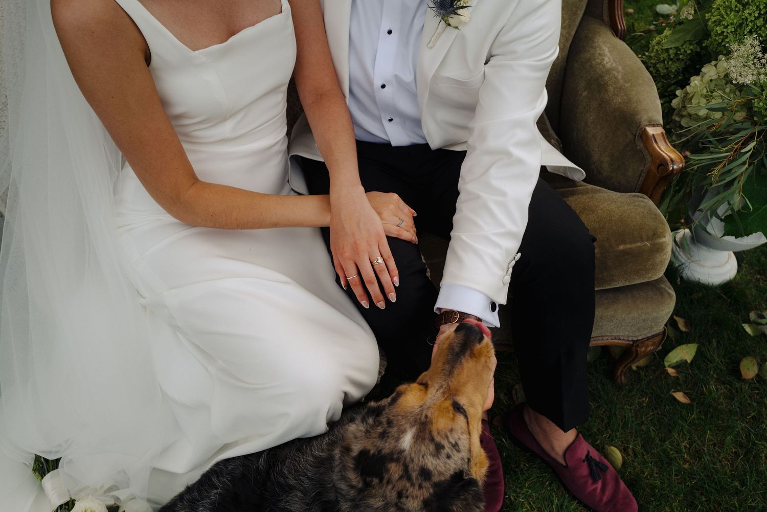 Elegant wedding couple shares intimate moments in an outdoor garden setting.